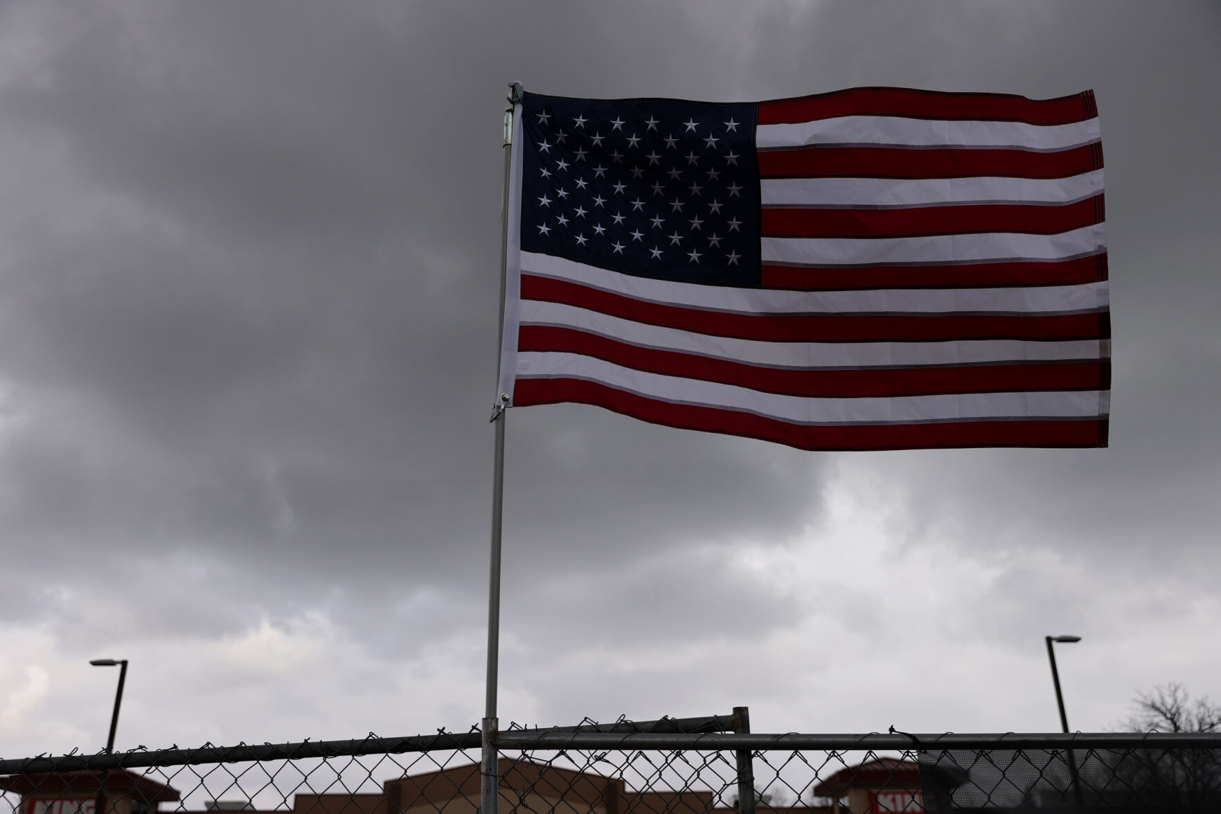 A flag for the United States flaps in the breeze outside the King Soopers on Table Mesa Drive in Boulder on March 23, 2021. A gunman killed 10 people in a mass shooting at the store the day before. (Forrest Czarnecki/The Gazette) (Forrest Czarnecki)