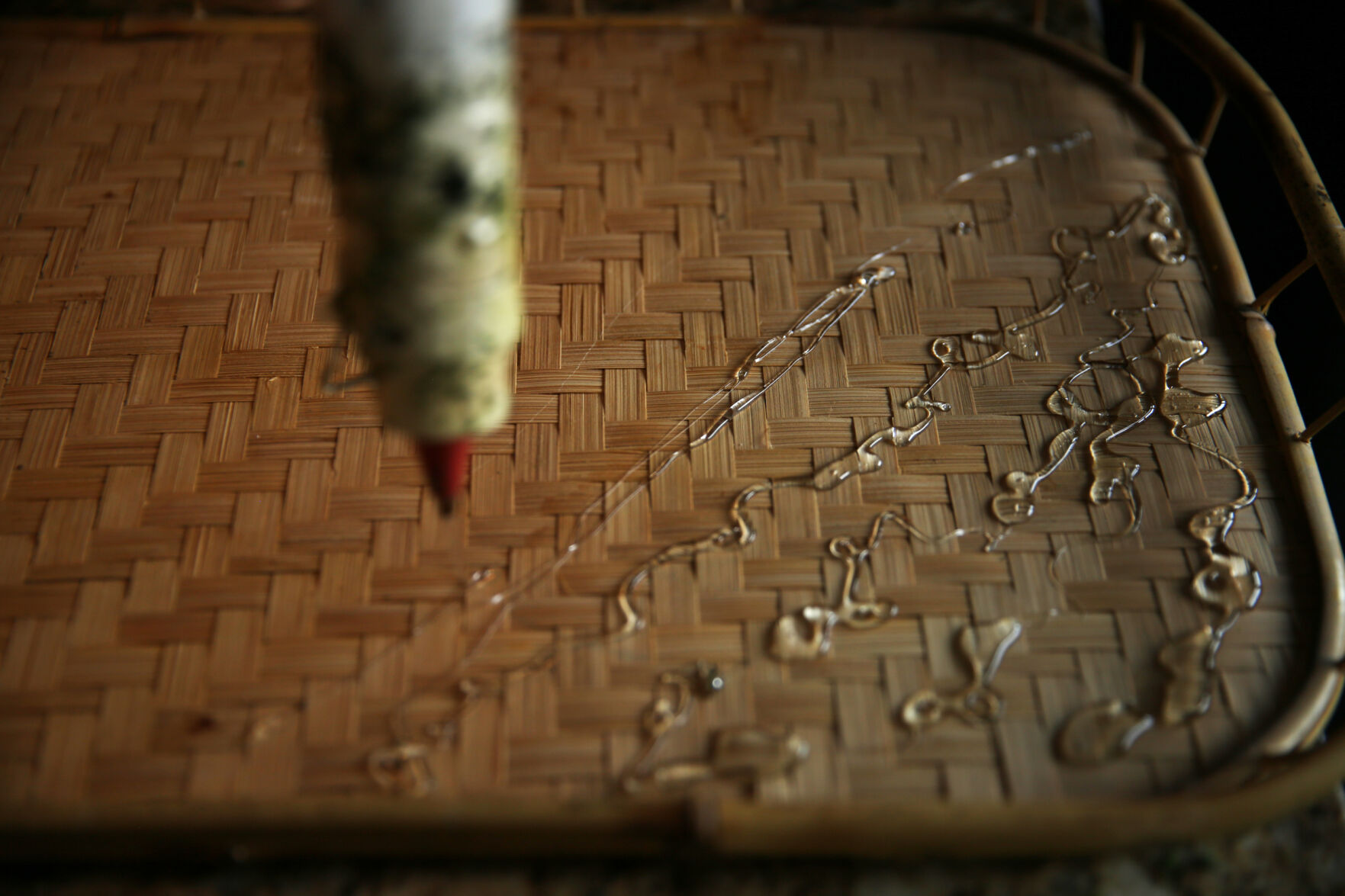 Some hot glue rests on the back of a new frame while Courtney Arnstein works on her moss art at her home in Colorado Springs on Feb. 12, 2021. (Forrest Czarnecki/The Gazette) (Forrest Czarnecki)