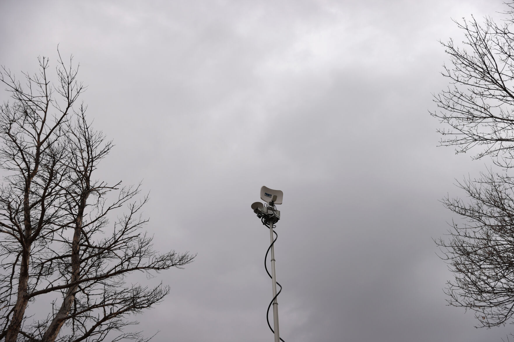 An antenna for a broadcast TV truck stands among some of the trees surrounding the King Soopers on Table Mesa Drive in Boulder on March 23, 2021. A gunman killed 10 people in a mass shooting at the store the day before. (Forrest Czarnecki/The Gazette) (Forrest Czarnecki)