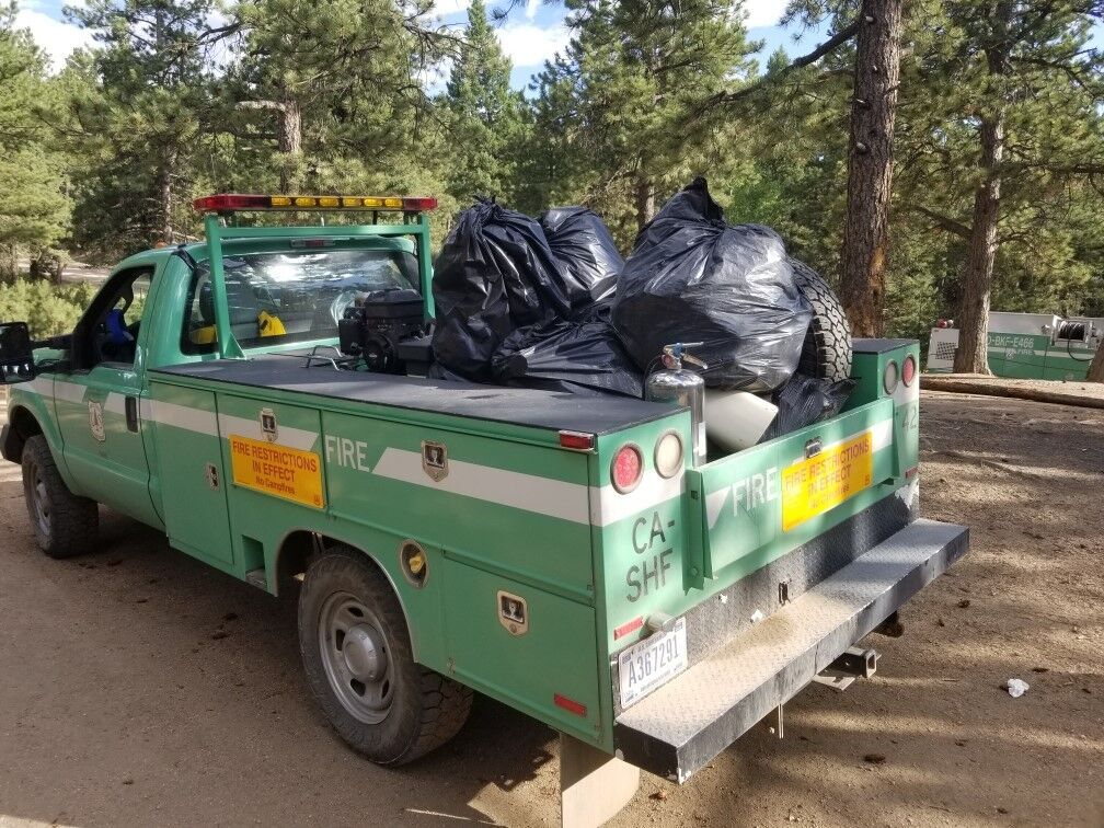 A U.S. Forest Service truck hauls out trash left at campsites last summer. Photo courtesy U.S. Forest Service
