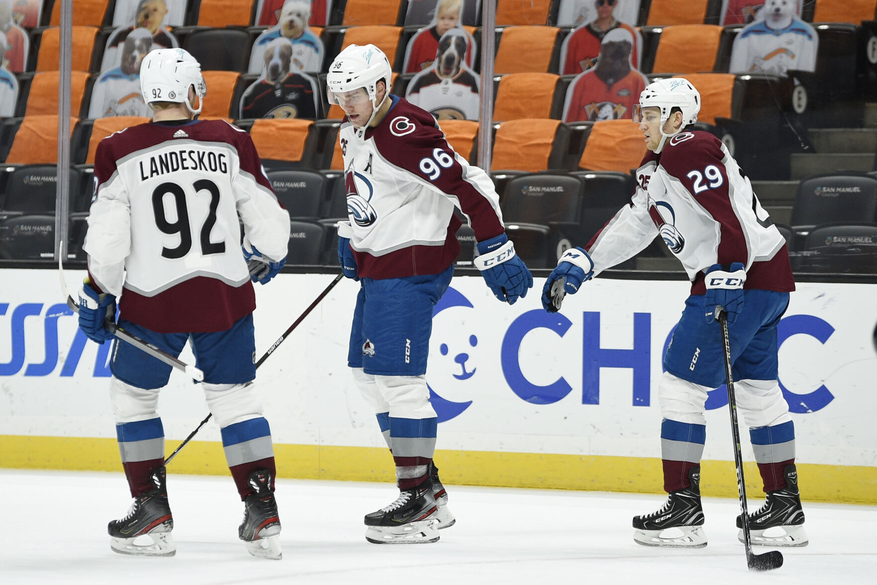 Colorado Avalanche left wing Mikko Rantanen, center, celebrates his empty-net goal with right wing Nathan MacKinnon and left wing Gabriel Landeskog, left, during the third period of the team's NHL game against the Anaheim Ducks in Anaheim, Calif., April 9, 2021. The Avalanche won 2-0. (AP Photo/Kelvin Kuo) (Kelvin Kuo)