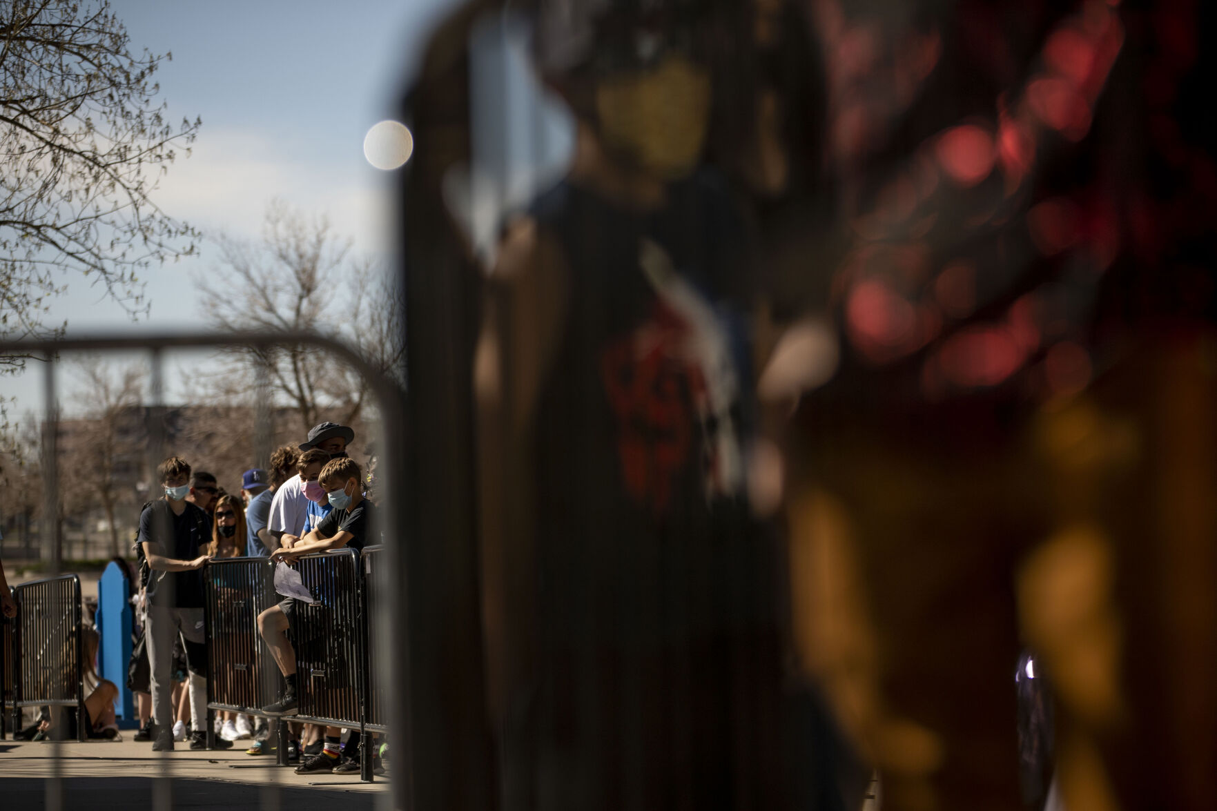 People wait in line for opening day at Elitch Gardens in Denver, Colo., on Saturday, May 1, 2021. The amusement park opened for the first time since Nov. 3, 2019, at 43% of their normal capacity without the water park. (Chancey Bush/ The Gazette) (Chancey Bush/ The Gazette)