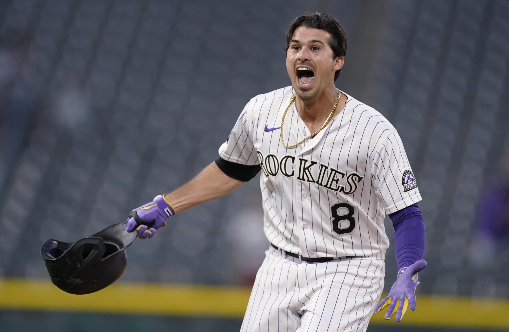 Colorado Rockies' Josh Fuentes celebrates after he drove in the winning run with a single off San Diego Padres relief pitcher Nick Ramirez during the eighth inning of the second game of a baseball doubleheader Wednesday, May 12, 2021, in Denver. The Rockies won 3-2. (AP Photo/David Zalubowski) (David Zalubowski)
