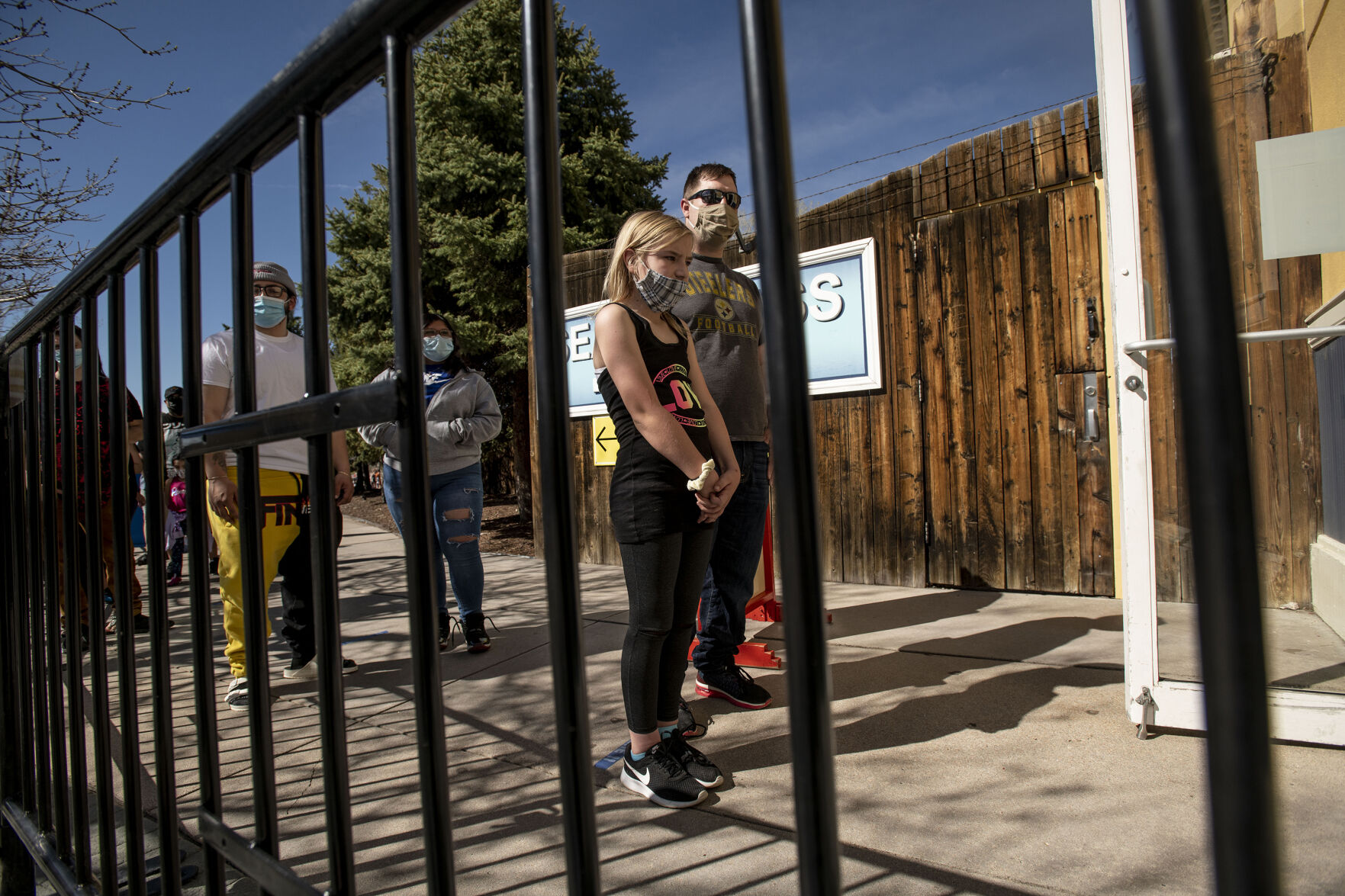 Shawn and his daughter Veronica, 10, wait in line for opening day at Elitch Gardens in Denver, Colo., on Saturday, May 1, 2021. The amusement park opened for the first time since Nov. 3, 2019, at 43% of their normal capacity without the water park. (Chancey Bush/ The Gazette) (Chancey Bush/ The Gazette)