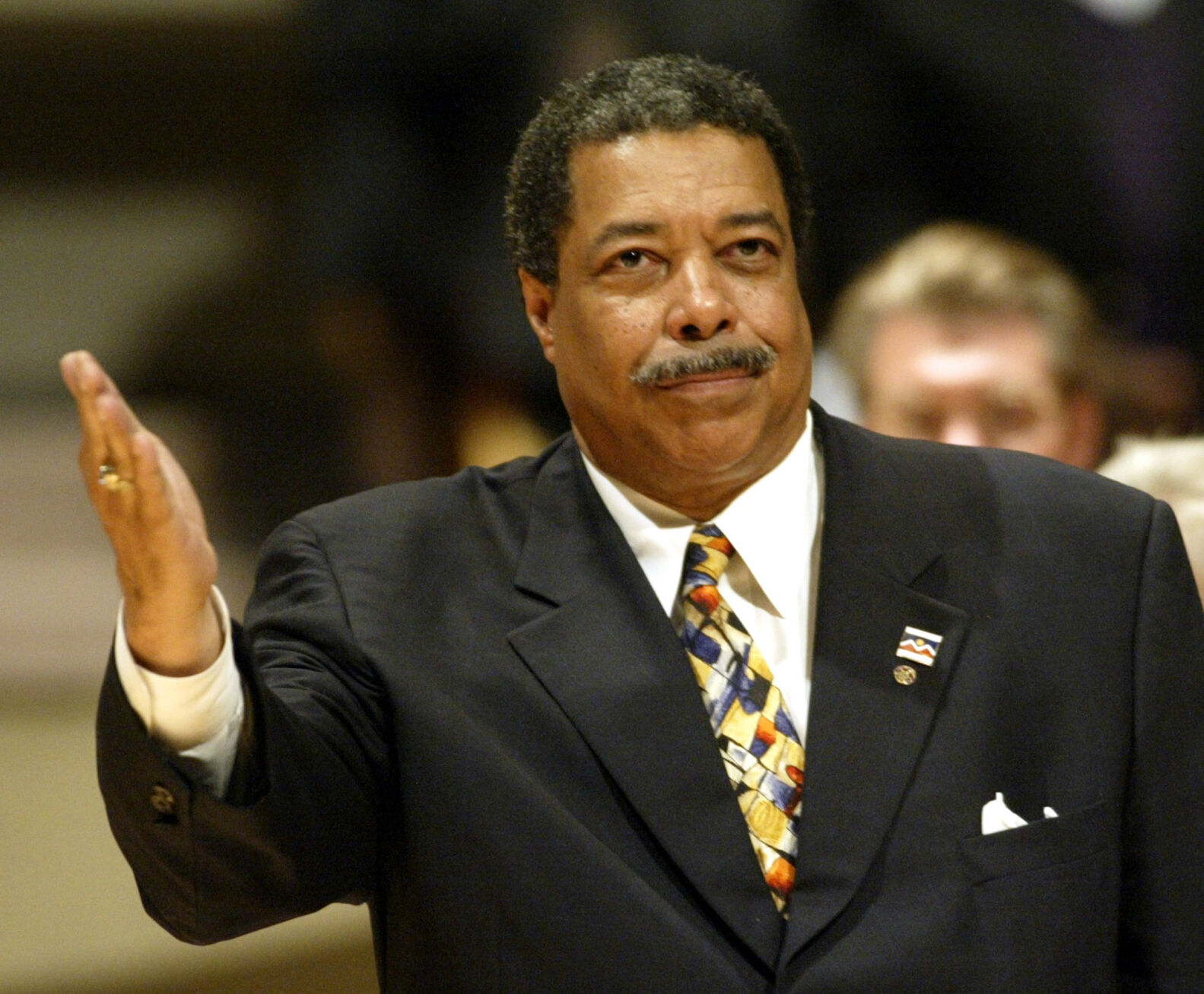 Former Denver mayor Wellington Webb waves to the crowd at the inauguration ceremony for the new mayor of Denver John Hickenlooper, Monday, July 21, 2003 in Denver. (AP Photo/Jack Dempsey) (JACK DEMPSEY)