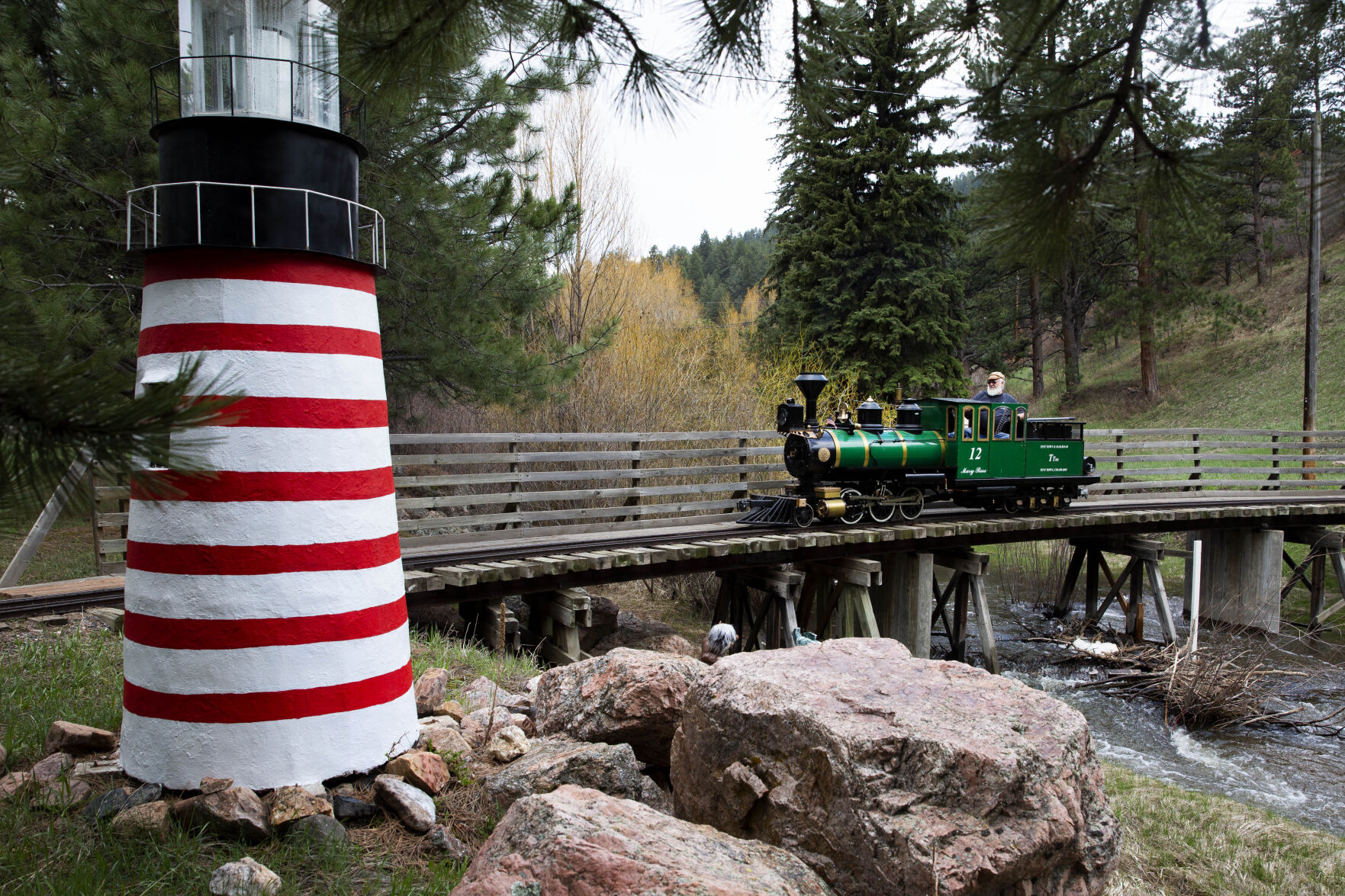 Engineer Dave Christopherson drives the diesel train ‘Mary Ross’ across a bridge on Friday, May 14, 2021 at the Tiny Town and Railroad in Morrison, Colo. Tiny Town will be re-opening on Saturday, May 29th for the 2021 season. (Katie Klann/The Gazette) (KatieKlannkatie.klann@gazette.comhttps://secure.gravatar.com/avatar/15e8af752374ad1abb67090ceaed3ec3?d=mm&r=g)