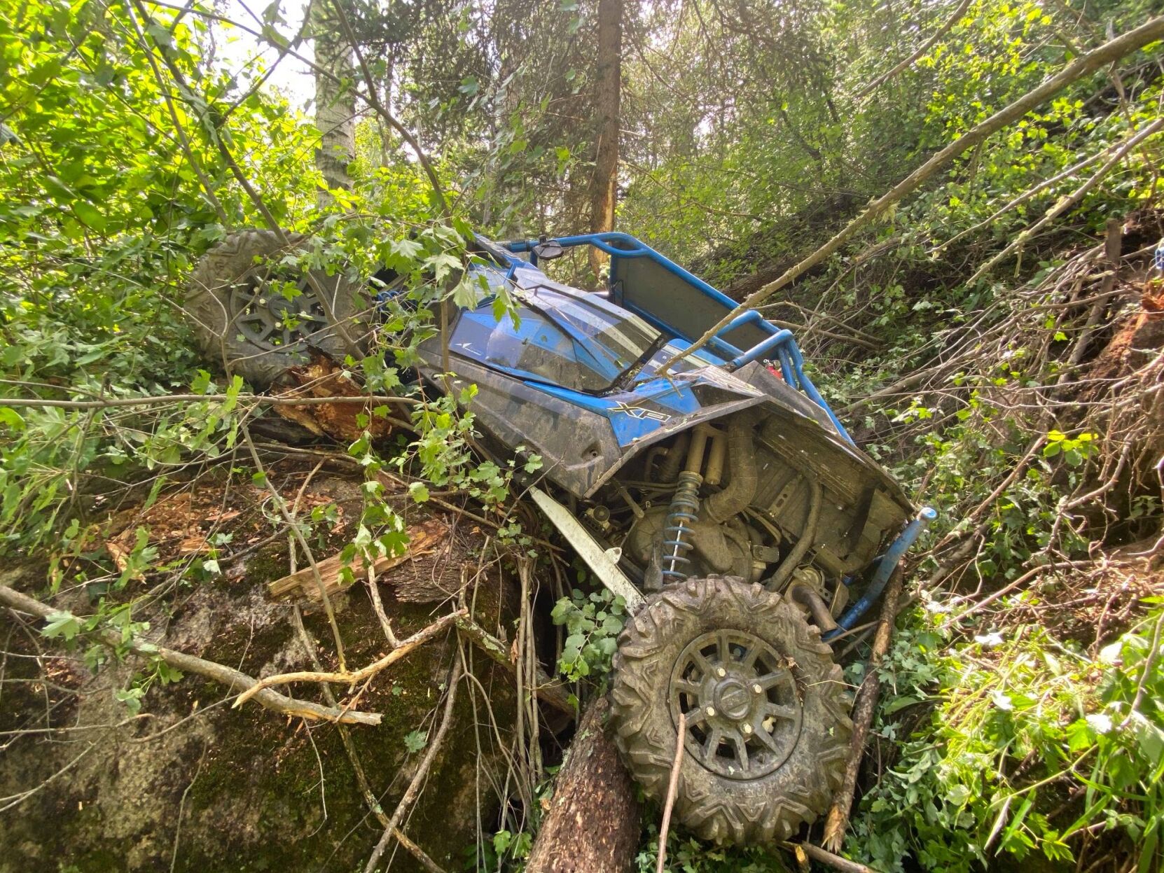 An ATV is pictured stuck in the woods -- one troubling sight pictured by Pike and San Isabel national forests rangers last summer. Photo courtesy U.S. Forest Service