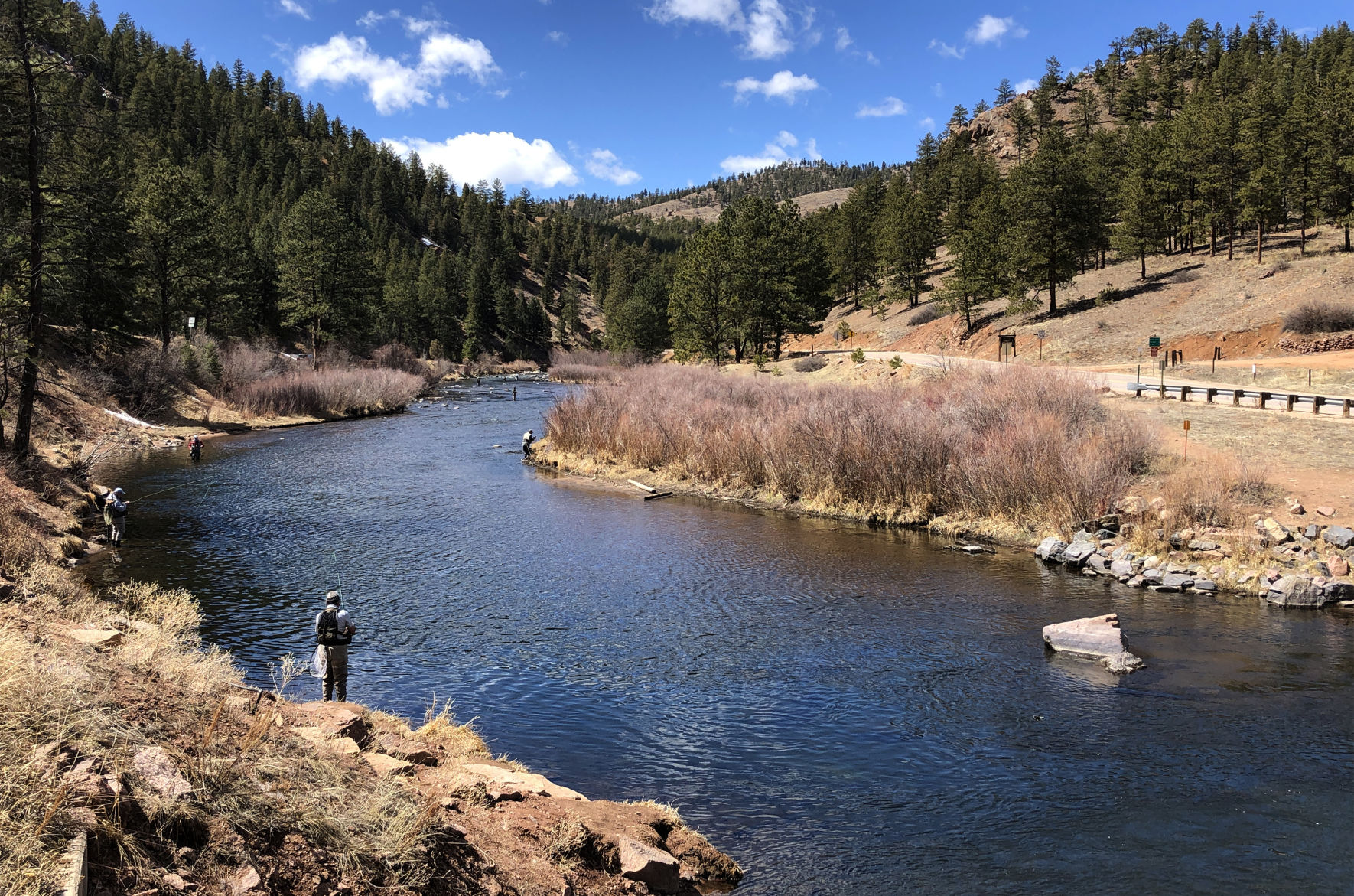 Anglers dot the South Platte River on a sunny afternoon in Deckers. Dozens were fly-fishing along miles of the famed trout stream in March 2020. (Nathan Van Dyne, The Gazette)