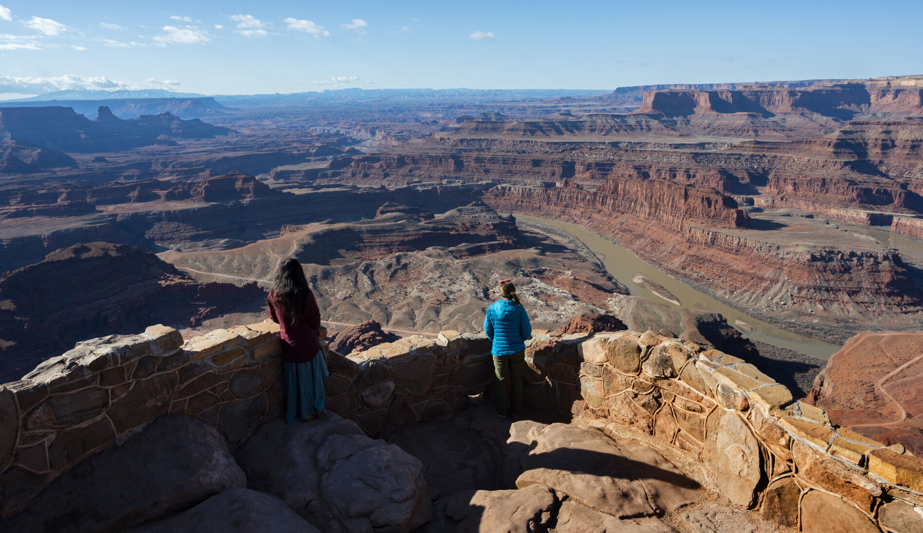 Visitors take in the view of the Colorado River 2,000-feet below Sunday, March 21, 2021, from the Dead Horse Point State Overlook in Dead Horse Point State Park near Moab, Utah. (The Gazette, Christian Murdock) (Christian Murdock/The Gazette)