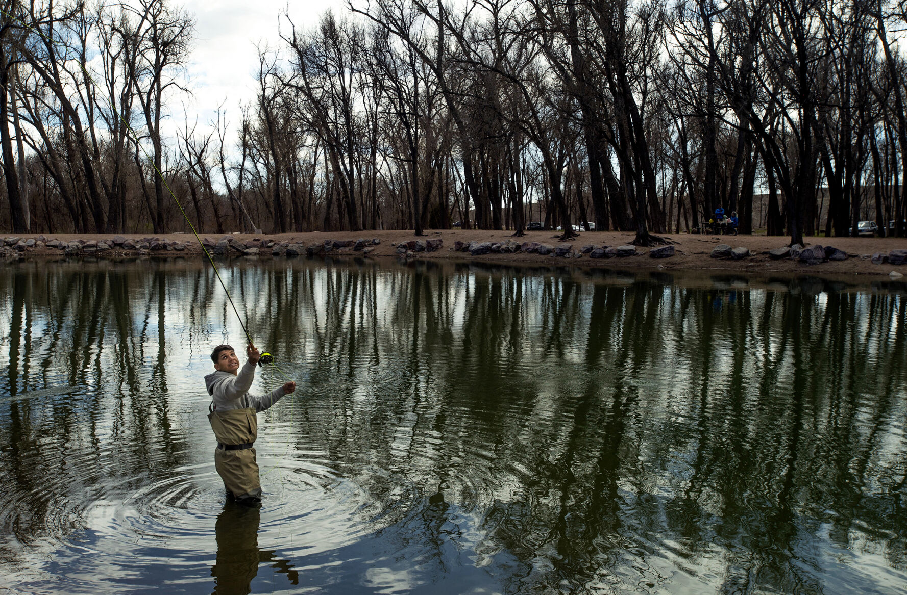 Roland Riley fly fishes at Willow Springs Ponds in Fountain. The ponds are stocked with bass, walleye, perch, bluegill, rainbow trout and channel catfish, providing a great fishing opportunity in El Paso County. (Chancey Bush, The Gazette)