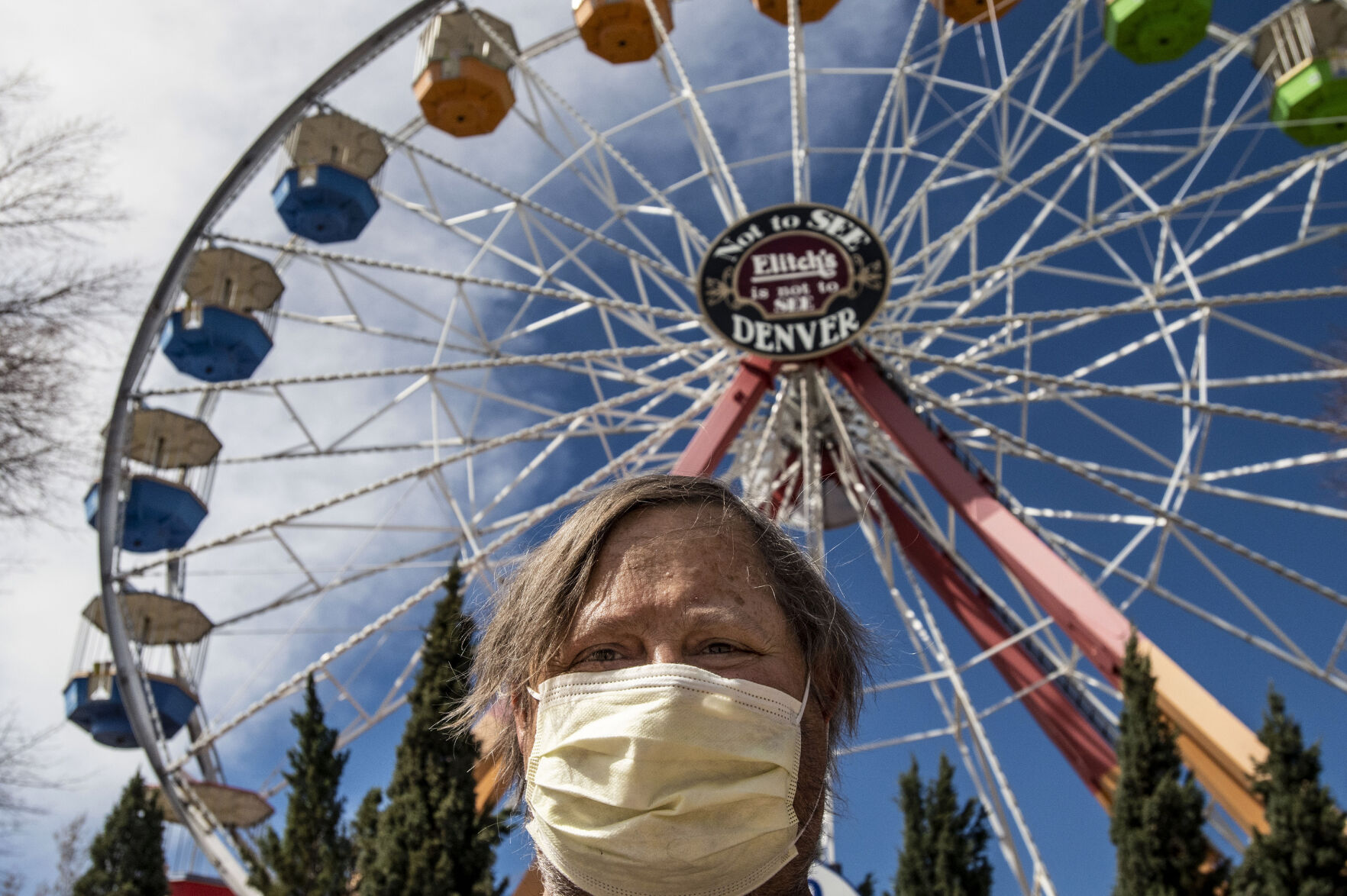 Kevin Moller, the self-proclaimed regular and amusement park enthusiast, has visited the park every day it's been open since 1995, waits for the rides to open during opening day at Elitch Gardens in Denver, Colo., on Saturday, May 1, 2021. The amusement park opened for the first time since Nov. 3, 2019, at 43% of their normal capacity without the water park. (Chancey Bush/ The Gazette) (Chancey Bush/ The Gazette)