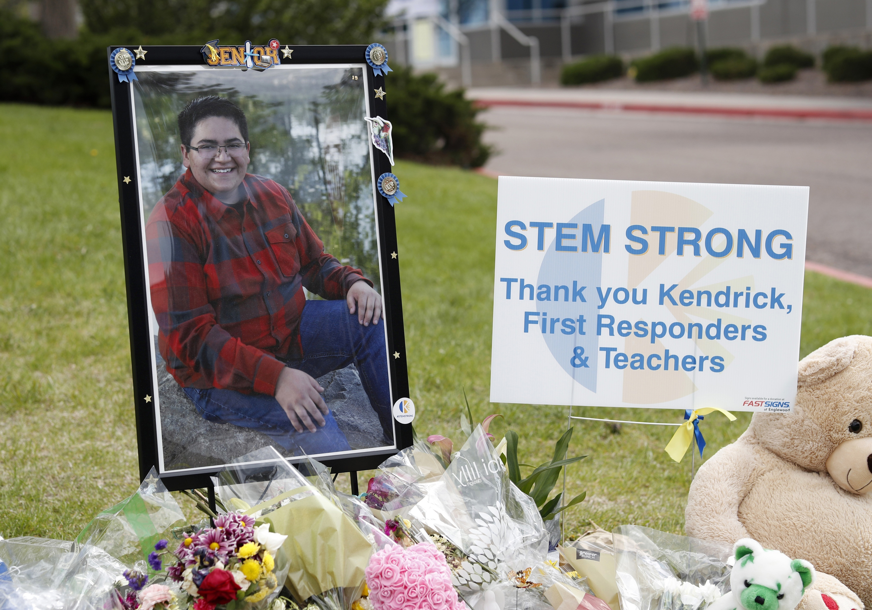 A photograph of student Kendrick Castillo stands amid a display of tributes outside the STEM School Highlands Ranch a week after the attack on the school that left Castillo dead and others injured, Tuesday, May 14, 2019, in Highlands Ranch, Colo. (AP Photo/David Zalubowski) (David Zalubowski)