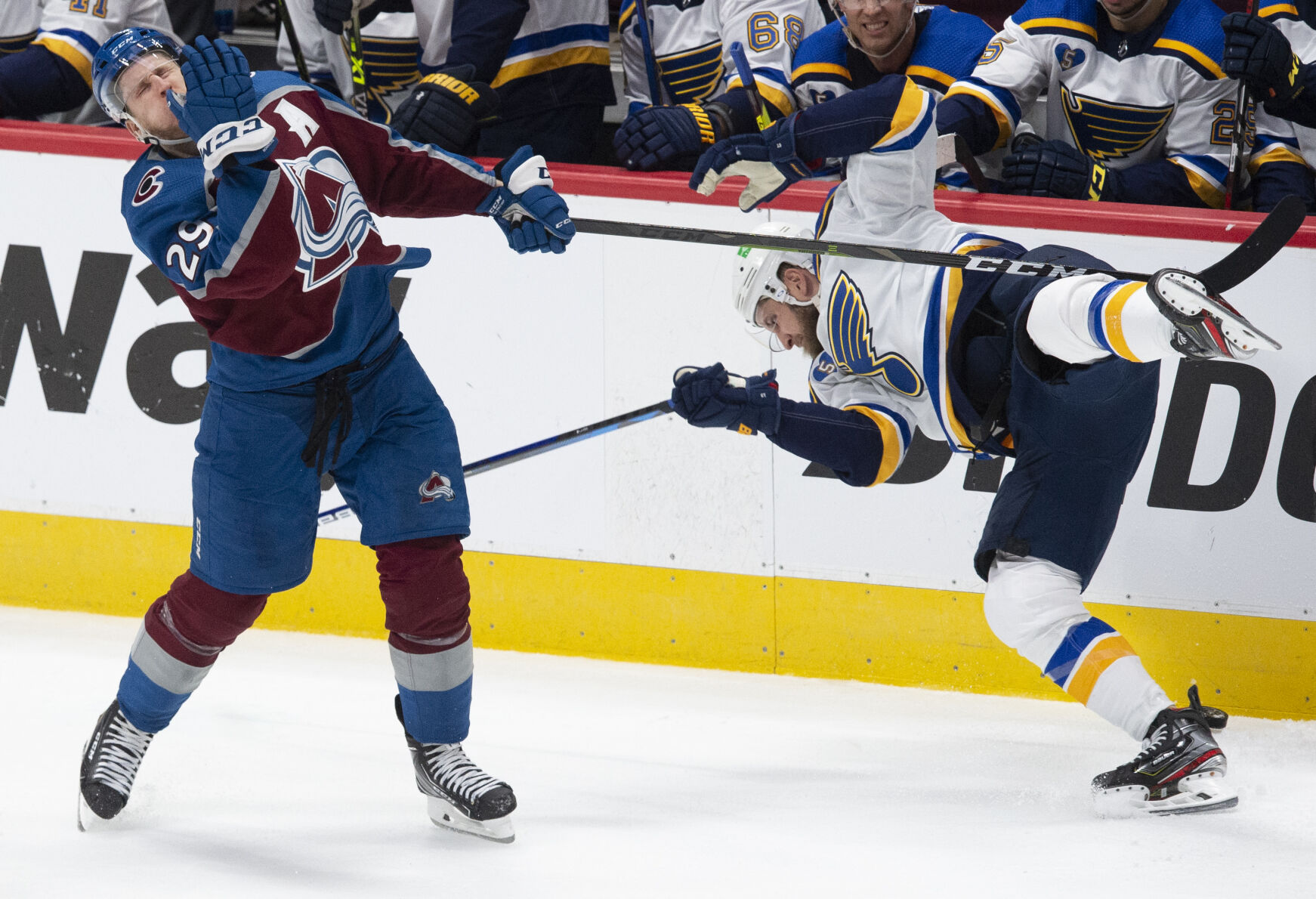 Colorado Avalanche center Nathan MacKinnon (29) crashes into St. Louis Blues left wing Kyle Clifford (13) during the third period of game one of the Stanley Cup playoffs Monday, May 17, 2021, at Ball Arena in Denver. (The Gazette, Christian Murdock) (Christian Murdock/The Gazette)