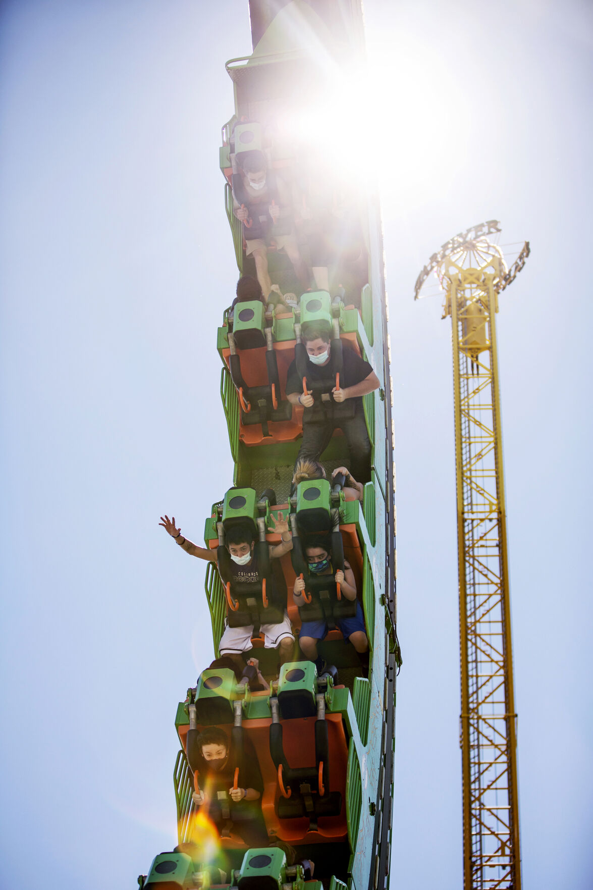 People ride Brain Drain during opening day at Elitch Gardens in Denver, Colo., on Saturday, May 1, 2021. The amusement park opened for the first time since Nov. 3, 2019, at 43% of their normal capacity without the water park. (Chancey Bush/ The Gazette) (Chancey Bush/ The Gazette)