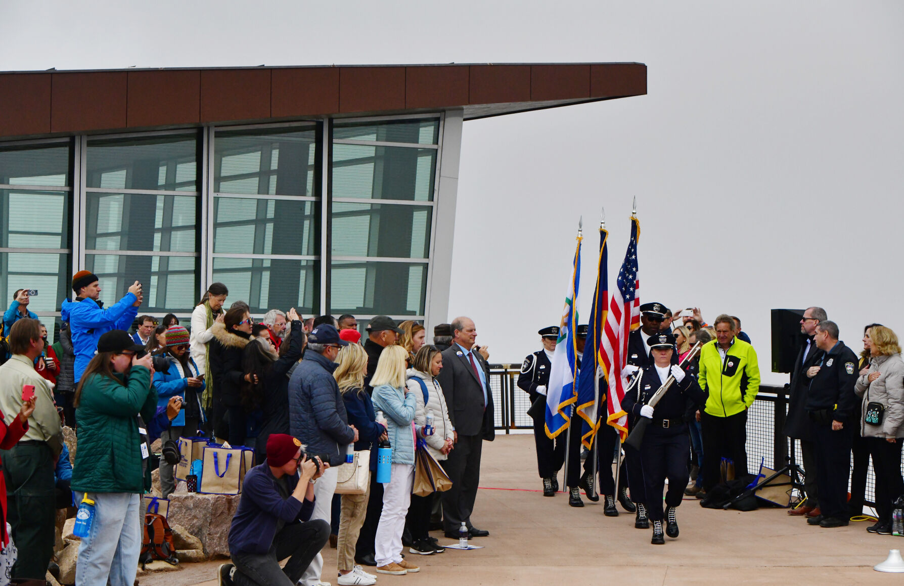 A CSPD honor guard posts the flags at the ribbon cutting for the Pikes Peak Summit Visitors Center on Wednesday, June 30, 2021. Dignitaries and V.I.P.’s first attended the ribbon cutting for the reopening of the Pikes Peak Cog Railway and then traveled to the top of Pikes Peak for the new visitors center ribbon cutting. (Photo by Jerilee Bennett, The Gazette