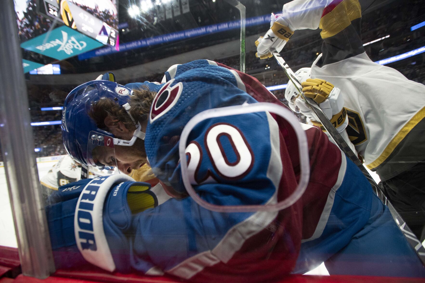 Colorado Avalanche left wing Brandon Saad (20) battles Vegas Golden Knights right wing Reilly Smith (19) against the boards during the second period of game two in the second round of the Stanley Cup Playoffs Wednesday, June 2, 2021, at Ball Arena in Denver. (The Gazette, Christian Murdock) (Christian Murdock/The Gazette)