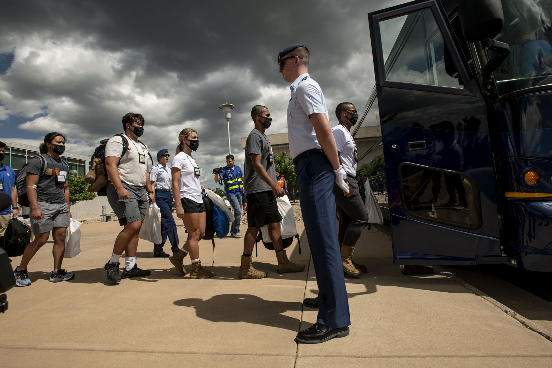 Basic cadets load onto a bus during In-Processing Day at the United States Air Force Academy in Colorado Springs, Colo., on Thursday, June 24, 2021. Over 1,100 incoming freshman will endure six weeks of basic training before officially becoming cadets.(Chancey Bush/ The Gazette) (Chancey Bush/ The Gazette)