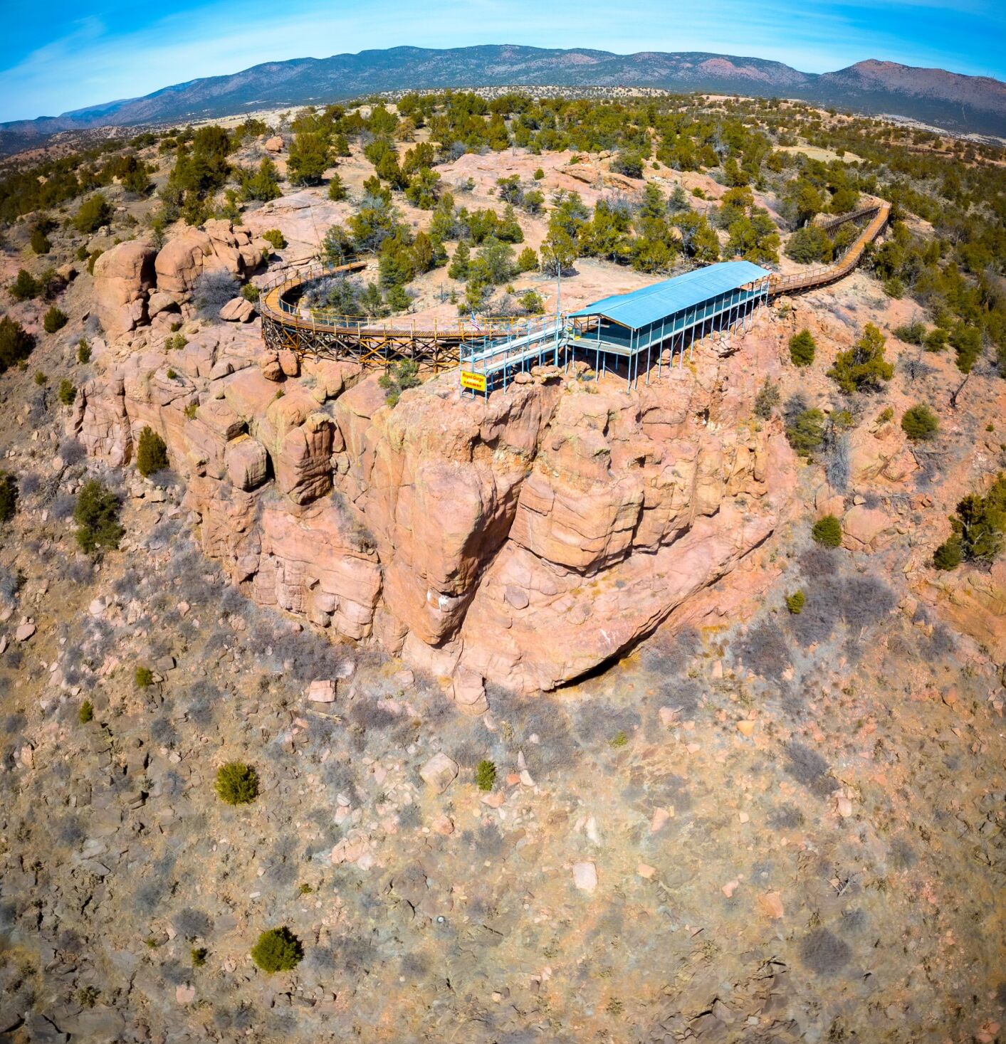 The Point Alta Vista Trail, comprised of a boardwalk following an old train route, leads to a long-beloved overlook of the Royal Gorge and mountains beyond Cañon City. Photo courtesy Ty Seufer