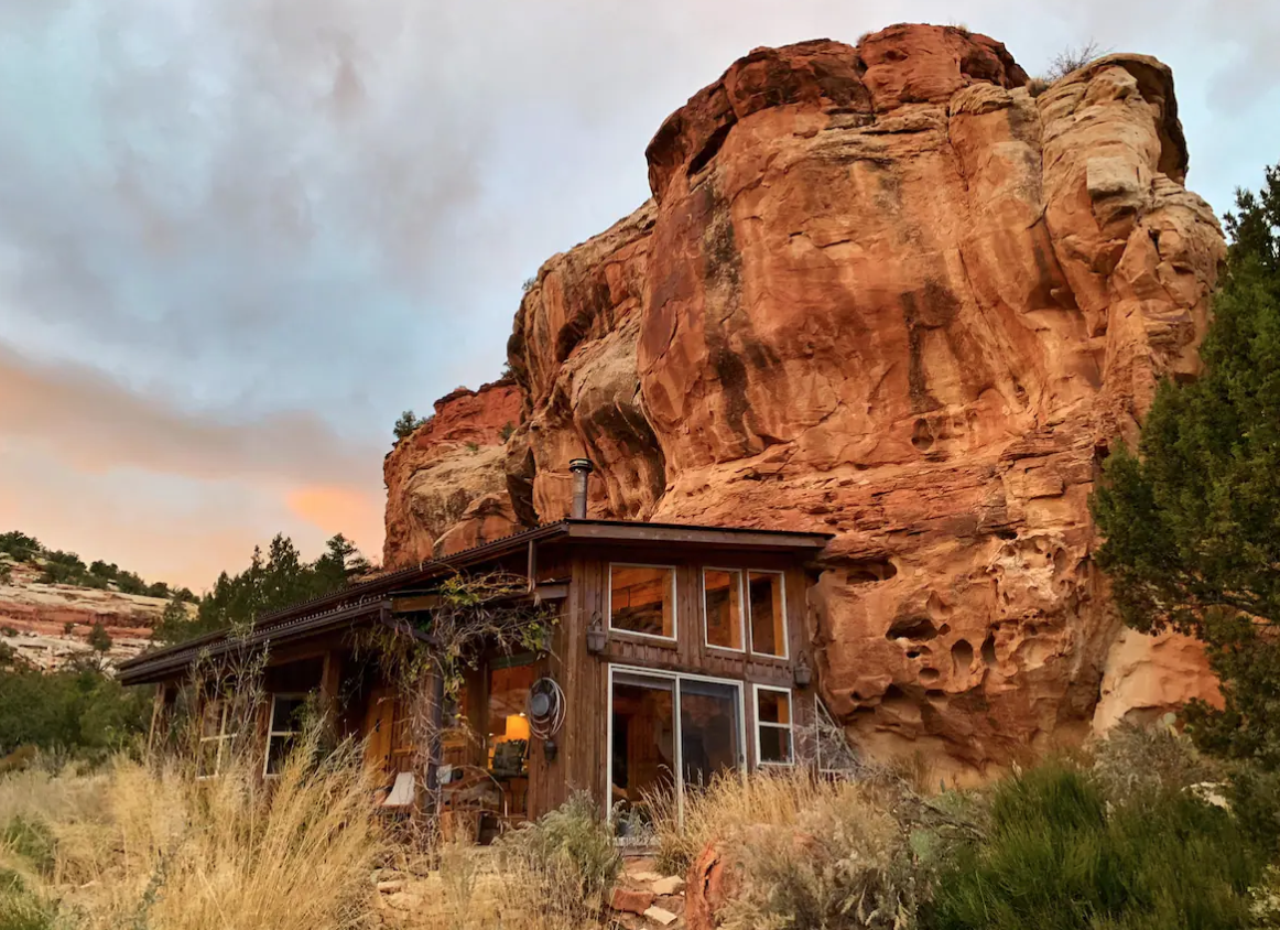 4. Spend the night in a house carved into cliffsidePlan a trip to the Sage Canyon Cliff House, built directly into dramatic red rock formations of a private canyon alcove just 20 minutes from Cortez and a short drive from Mesa Verde National Park. Rates hover around $280 a night. More details can be found here. Photo Credit: Grant and Laura Blakeman via Airbnb.