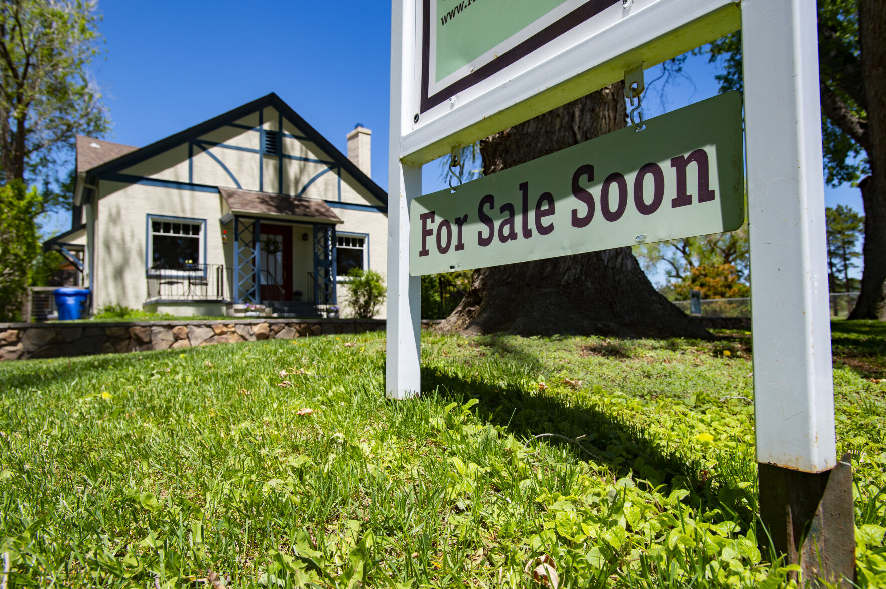 A “For Sale Soon” sign stands outside a home in May 2021 in the Patty Jewett neighborhood in central Colorado Springs. Surging housing prices have pushed the cost of living in Colorado Springs to a record 106.8% of the national average during the first quarter.