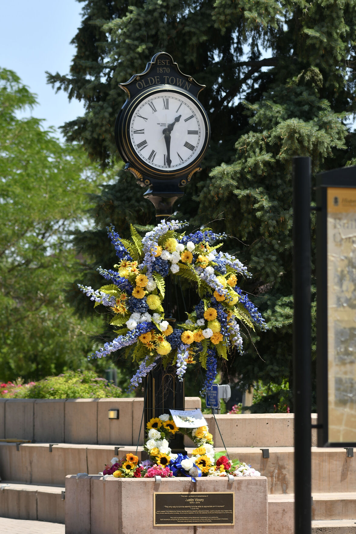 JUNE 22, 2021 - A growing memorial a the base of the clock at the fountain in Olde Town Arvada where a shooting took place that left three people dead, including Arvada veteran police officer Gordon Beesley, another person was also killed after being shot by the gunman and the suspect was also shot and killed. (Photo by John Leyba) (John Leyba)