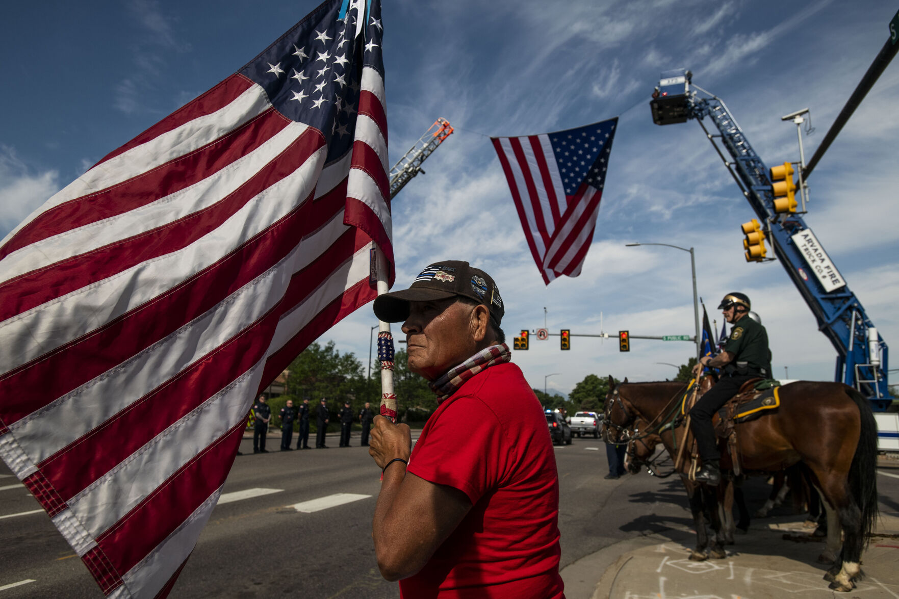 Army veteran Bill pays his respects to slain Arvada police officer Gordon Beesley during a funeral procession in Lafayette, Colo., on Tuesday, June 29, 2021. A funeral was held at the Flatirons Community Church for officer Beesley, who was a 19-year veteran of the Arvada Police Department. Officer Beesley was killed by a gunman in Olde Town Arvada plaza on June 21, 2021. (Chancey Bush/ The Gazette) (Chancey Bush)