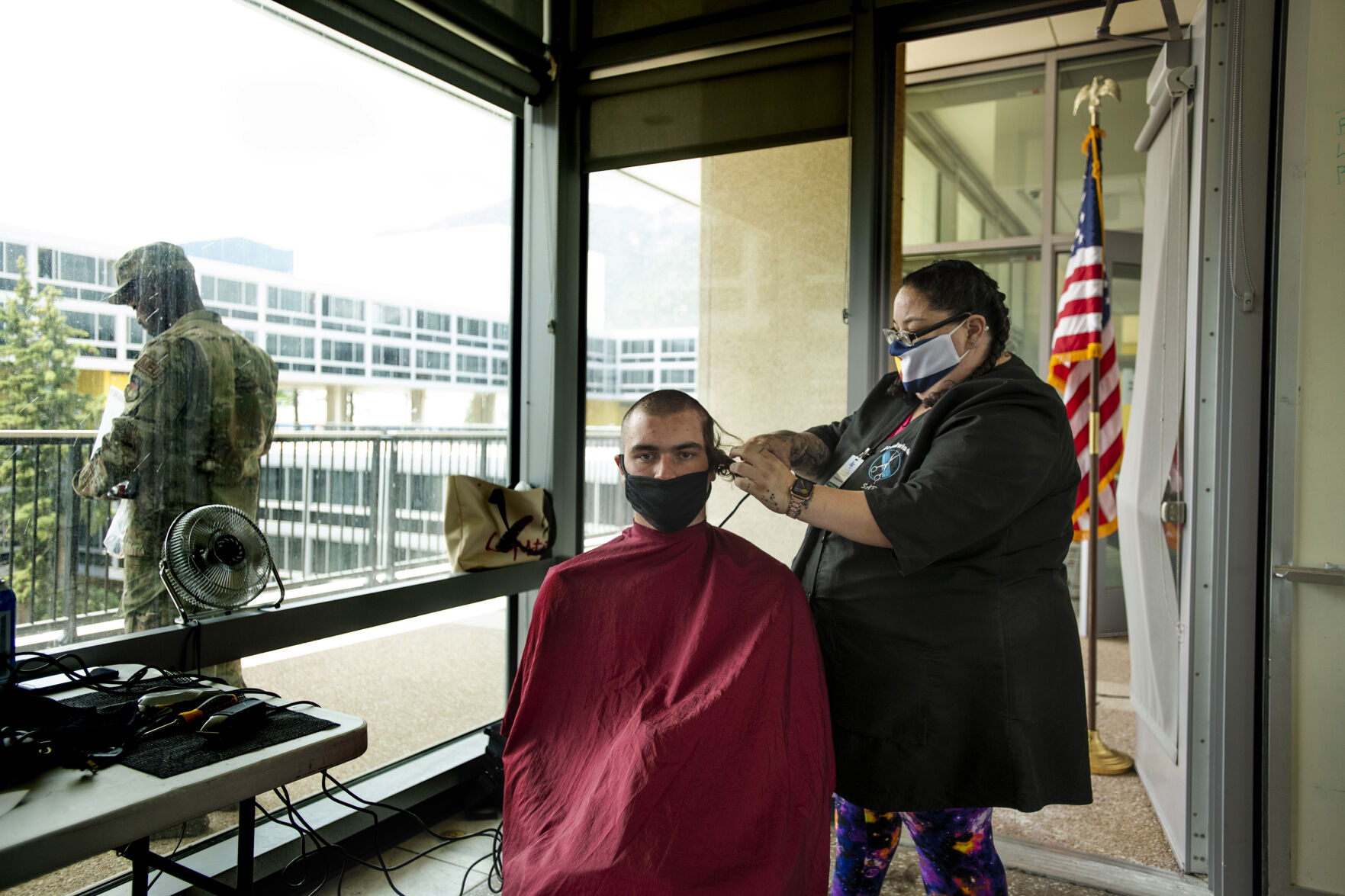 Basic cadets get their heads shaved during In-Processing Day at the United States Air Force Academy in Colorado Springs, Colo., on Thursday, June 24, 2021. Over 1,100 incoming freshman will endure six weeks of basic training before officially becoming cadets.(Chancey Bush/ The Gazette) (Chancey Bush/ The Gazette)