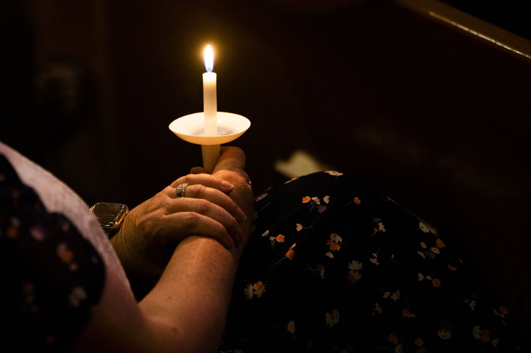 Community members light candles during a vigil for fallen officer Gordon Beesley on Tuesday evening in Arvada. (Katie Klann, The Gazette)