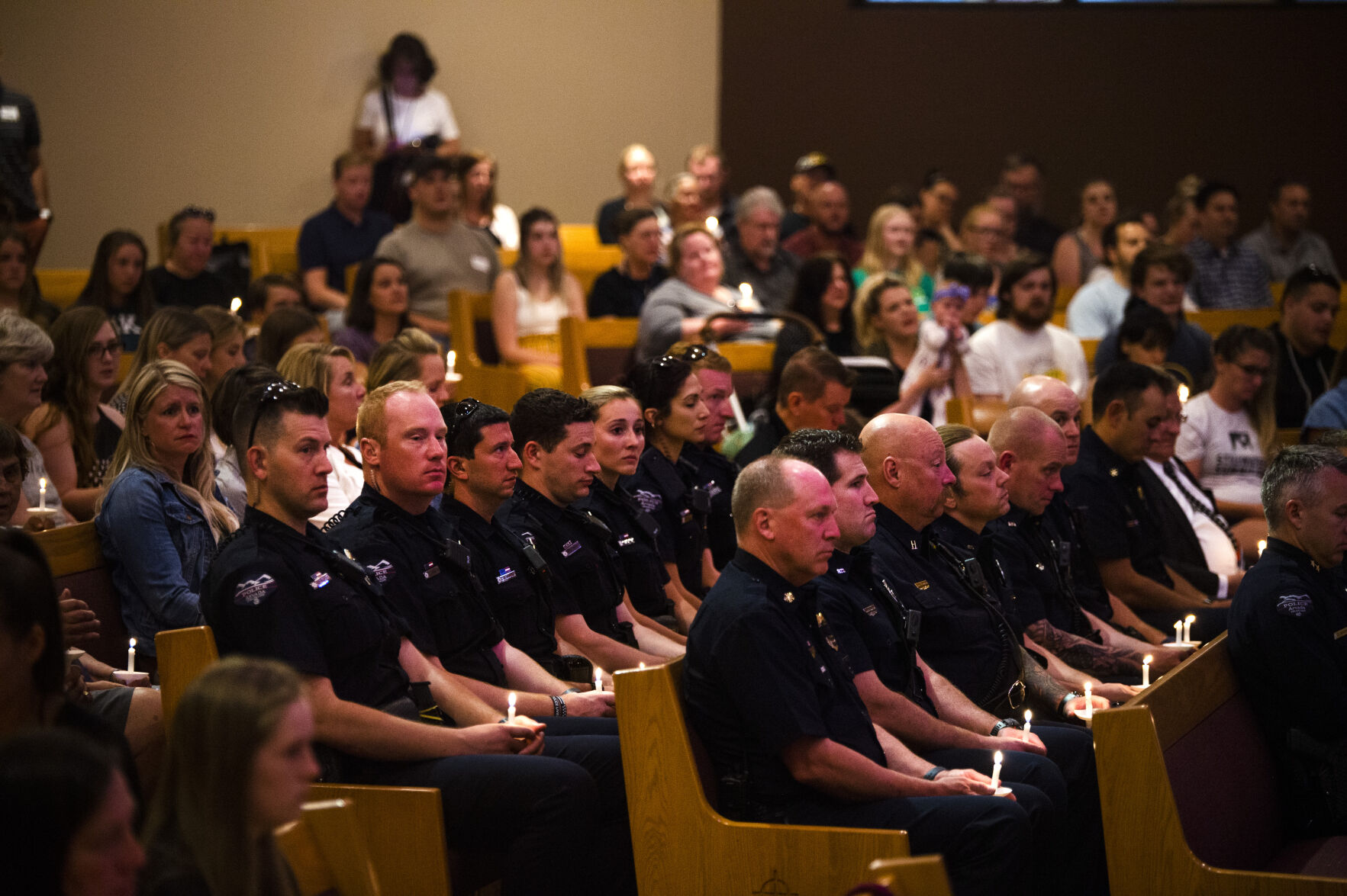 Members of the Arvada Police Department sit together during a community vigil for fallen Officer Gordon Beesley on Tuesday, June 22, 2021 at Peace Lutheran Church in Arvada, Colo. (Katie Klann/The Denver Gazette) (Katie Klann The Gazette)