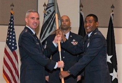 {span}Col. Marcus Jackson, right, incoming Buckley Garrison commander, receives the guidon from Lt. Gen. Stephen Whiting, left, Space Operations Command commander, during the Buckley Garrison Assumption of Command Ceremony at Buckley Space Force Base, Colo., June 4, 2021. The passing of the guidon is a symbolic tradition accomplished in front of the unit so all can witness the new commander assuming the position. (U.S. Space Force photo by Senior Airman Danielle McBride){/span}