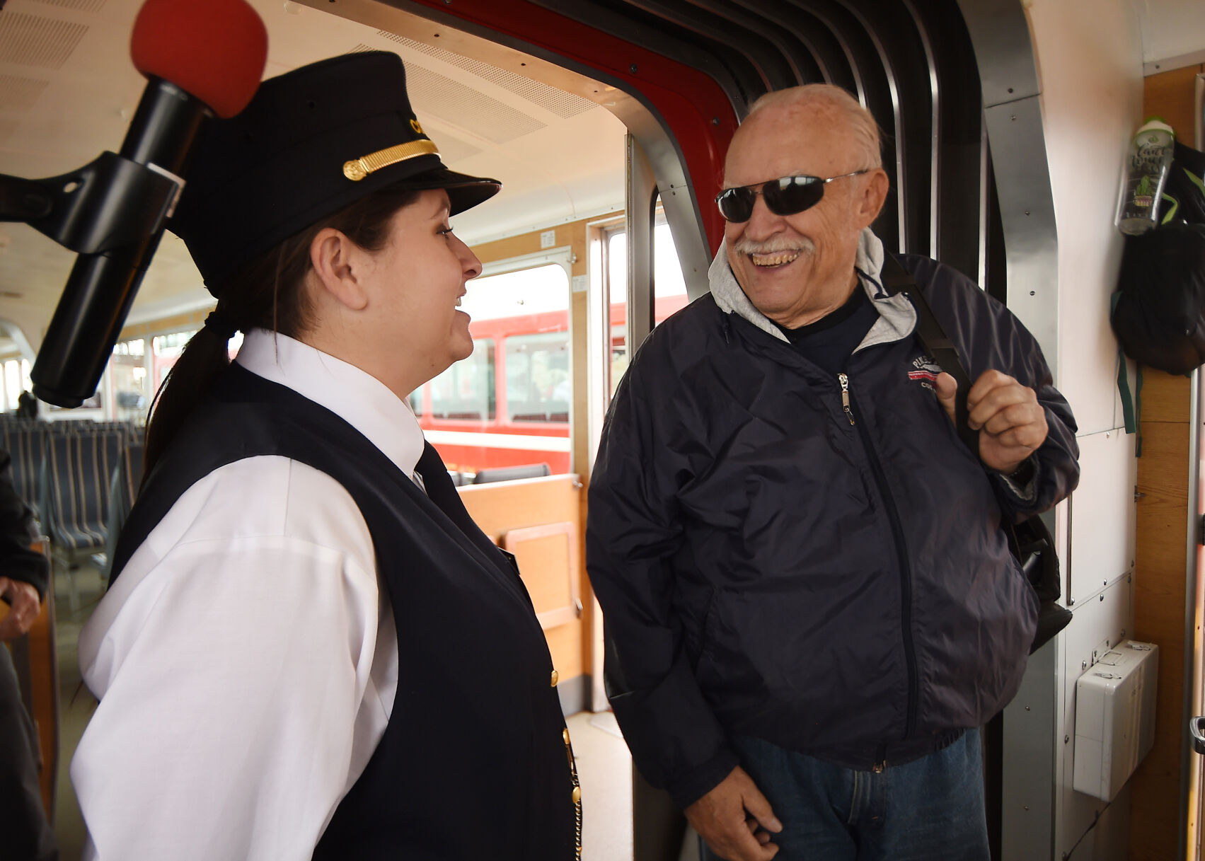 Mel McFarland was a conductor on the Pikes Peak Cog Railway for 16 years. He chats with one of the new conductors, Natalie Bauta, after the grand reopening trip up Pikes Peak on Wednesday, June 30, 2021. (Photo by Jerilee Bennett, The Gazette