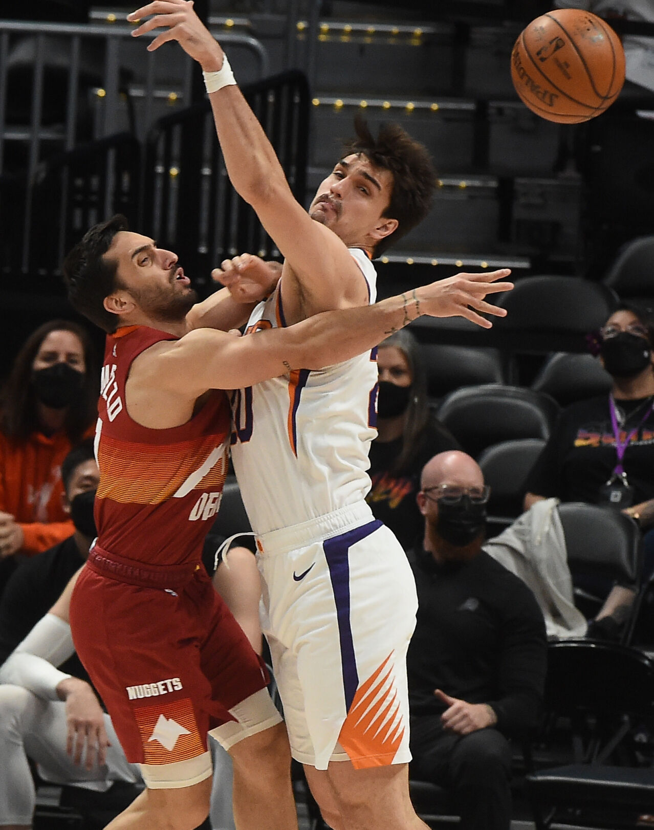 Denver’s Facu Campazzo passes the ball past Phoenix’s Dario Saric during the second quarter of game 4 of the conference semifinals at Ball Arena on Sunday, June 13, 2021. (Photo by Jerilee Bennett, The Gazette) (JERILEE BENNETT)