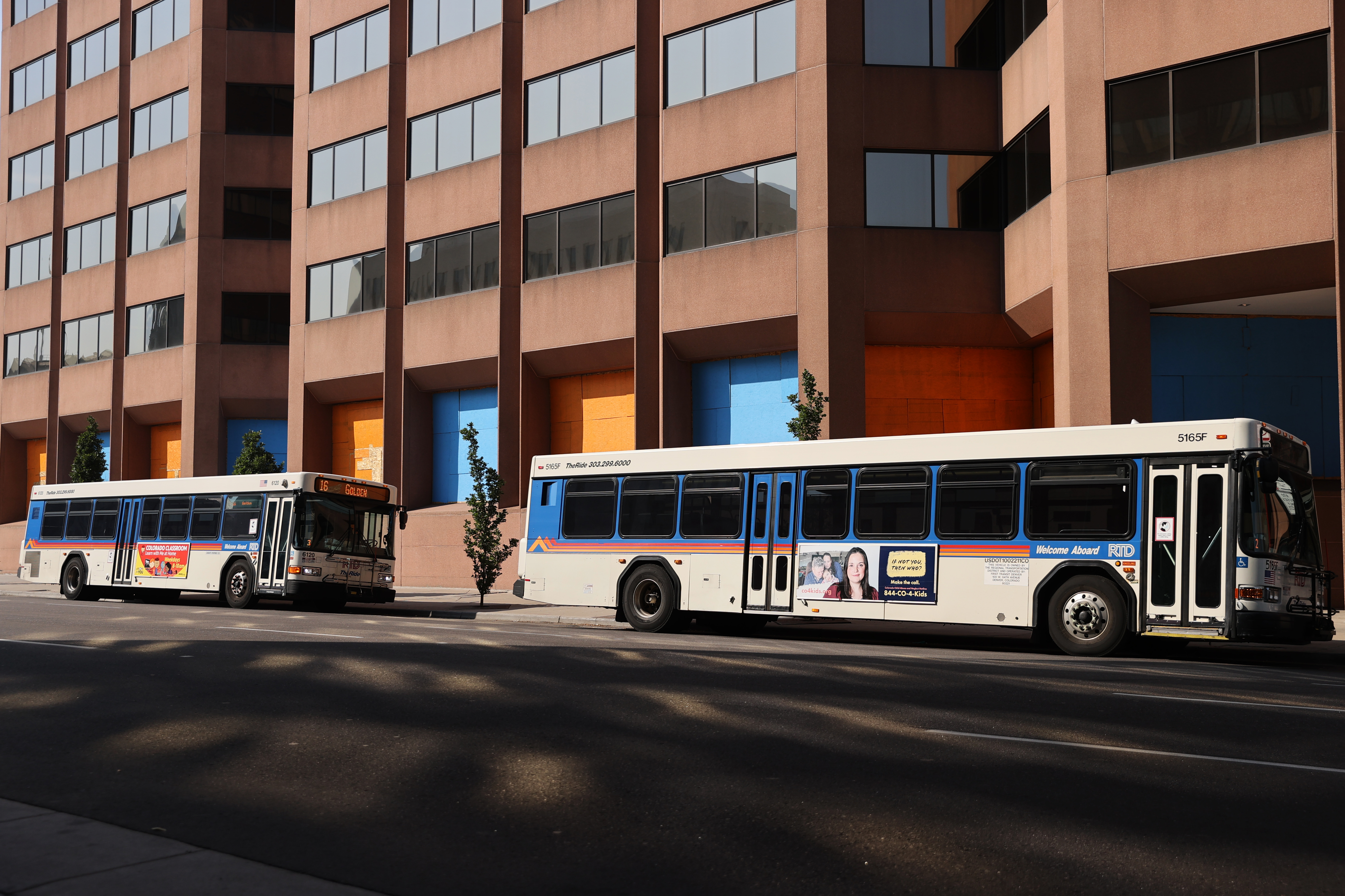 A pair of RTD buses are parked on Lincoln Street past the RTD downtown terminal in Denver on Oct. 2, 2020. (Forrest Czarnecki/The Denver Gazette) (Forrest Czarnecki)