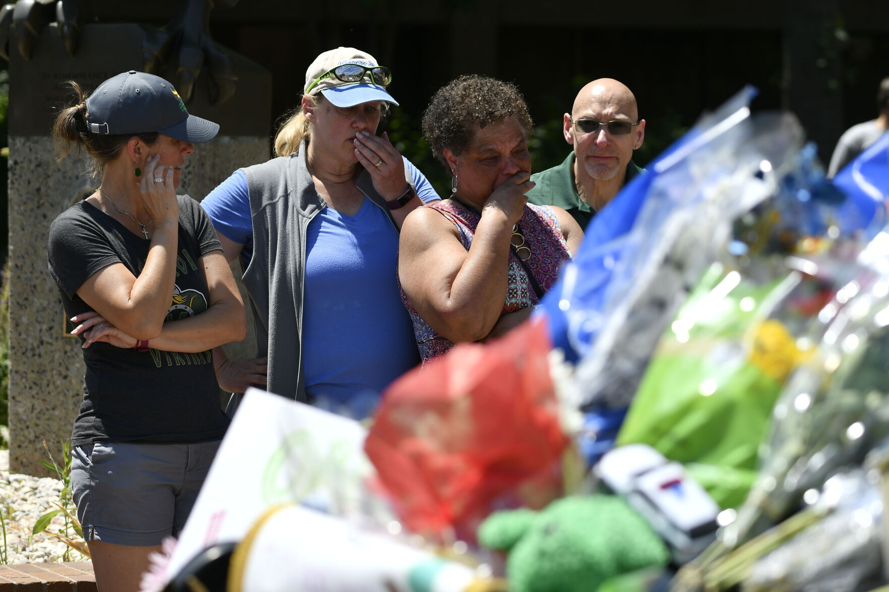 JUNE 22, 2021 - Staff members from Oberon Middle School gather at the police station to pay their respect to Arvada veteran police officer Gordon Beesley, who was killed during a shooting in Olde Town Arvada. Another person was also killed after being shot by the gunman and the suspect was also shot and killed. The staff from Oberon Middle School marched to the police station where the officers patrol car is on display covered with flowers and several flags. (Photo by John Leyba) (John Leyba)