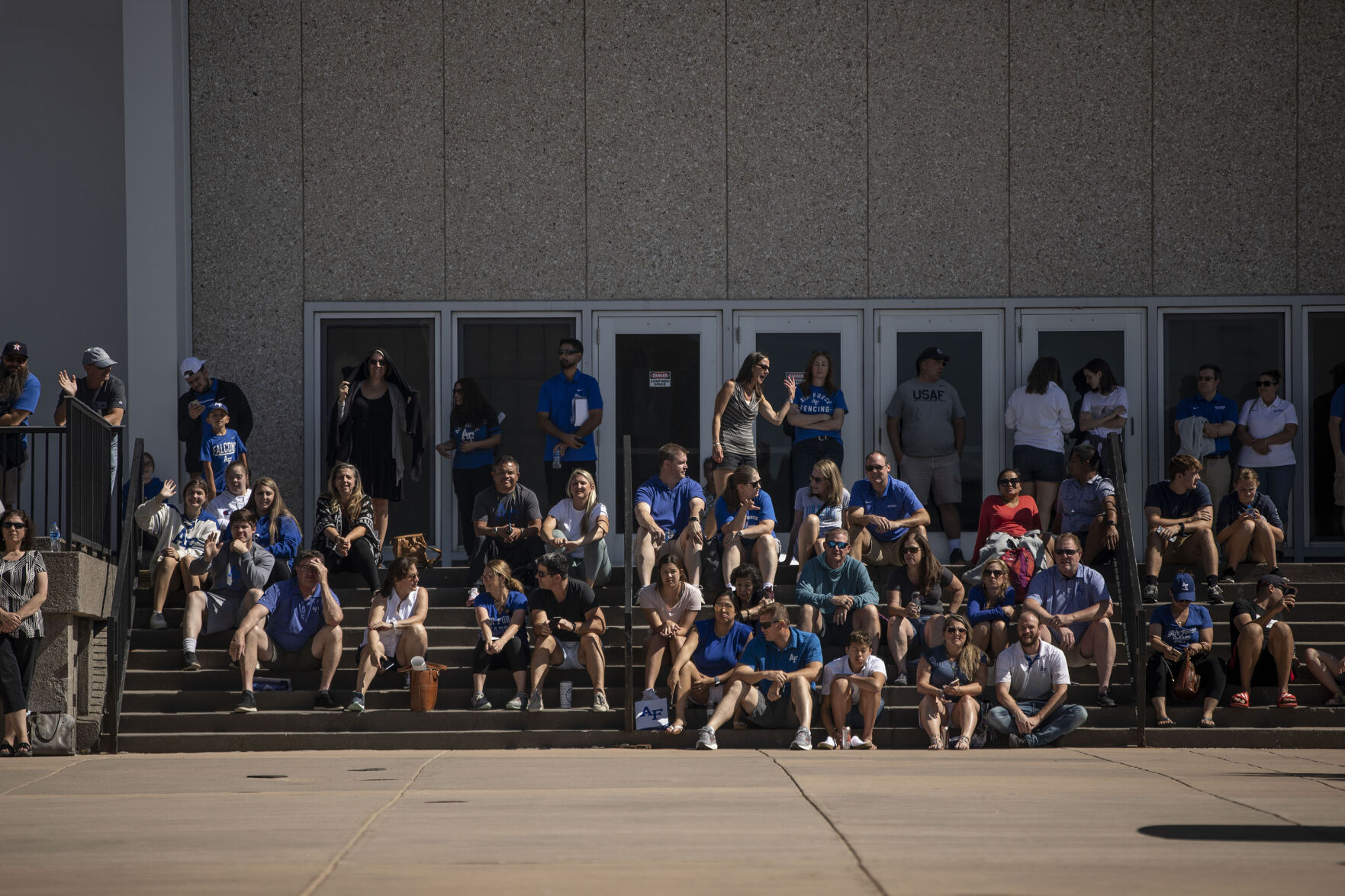 Family watches as the basic cadets make their way to the bus during In-Processing Day at the United States Air Force Academy in Colorado Springs, Colo., on Thursday, June 24, 2021. Over 1,100 incoming freshman will undergo six weeks of basic training before officially becoming cadets.(Chancey Bush/ The Gazette) (Chancey Bush/ The Gazette)