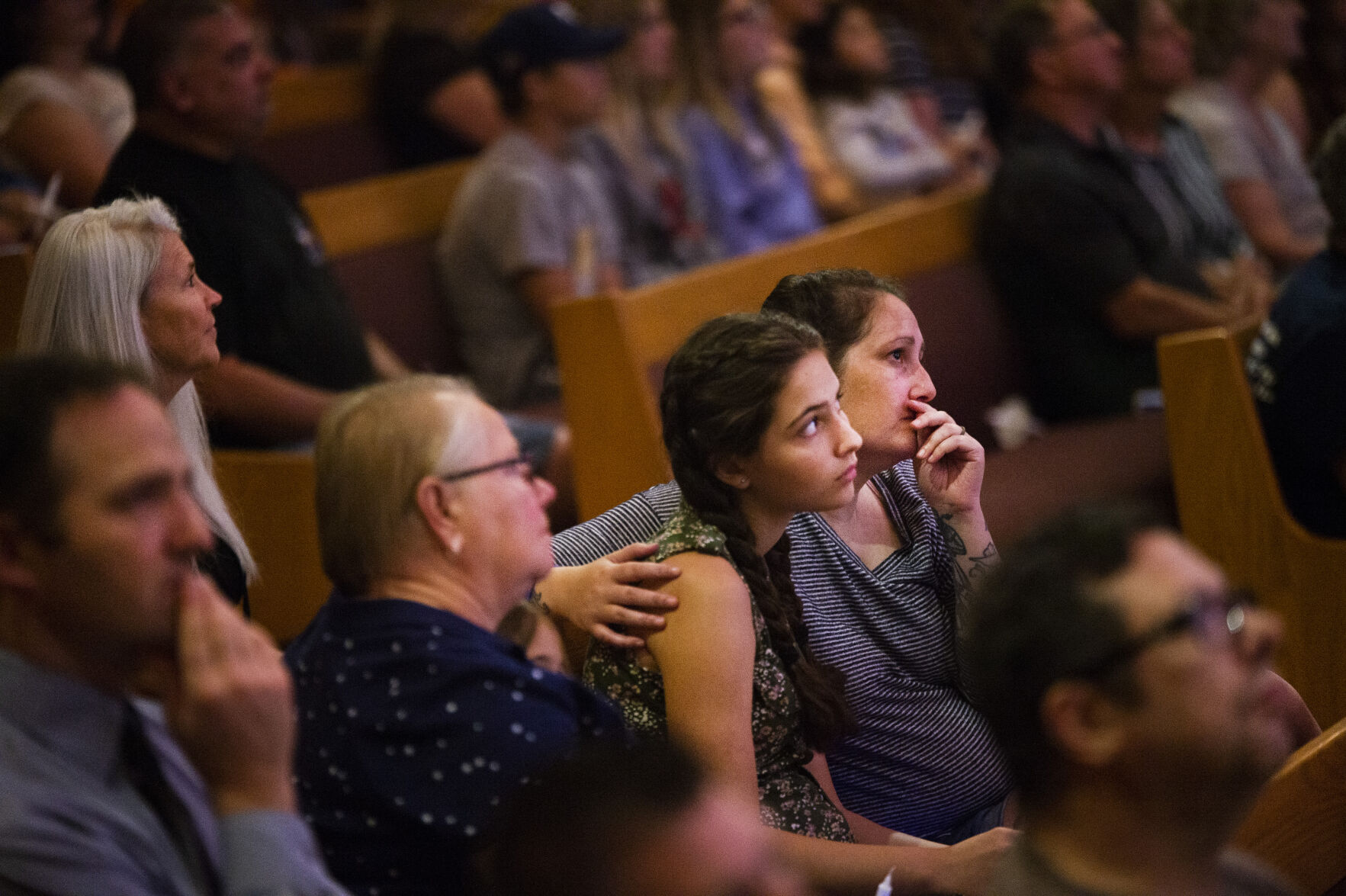 Community members listen during a community vigil for fallen Officer Gordon Beesley on Tuesday, June 22, 2021 at Peace Lutheran Church in Arvada, Colo. (Katie Klann/The Denver Gazette) (Katie Klann The Gazette)