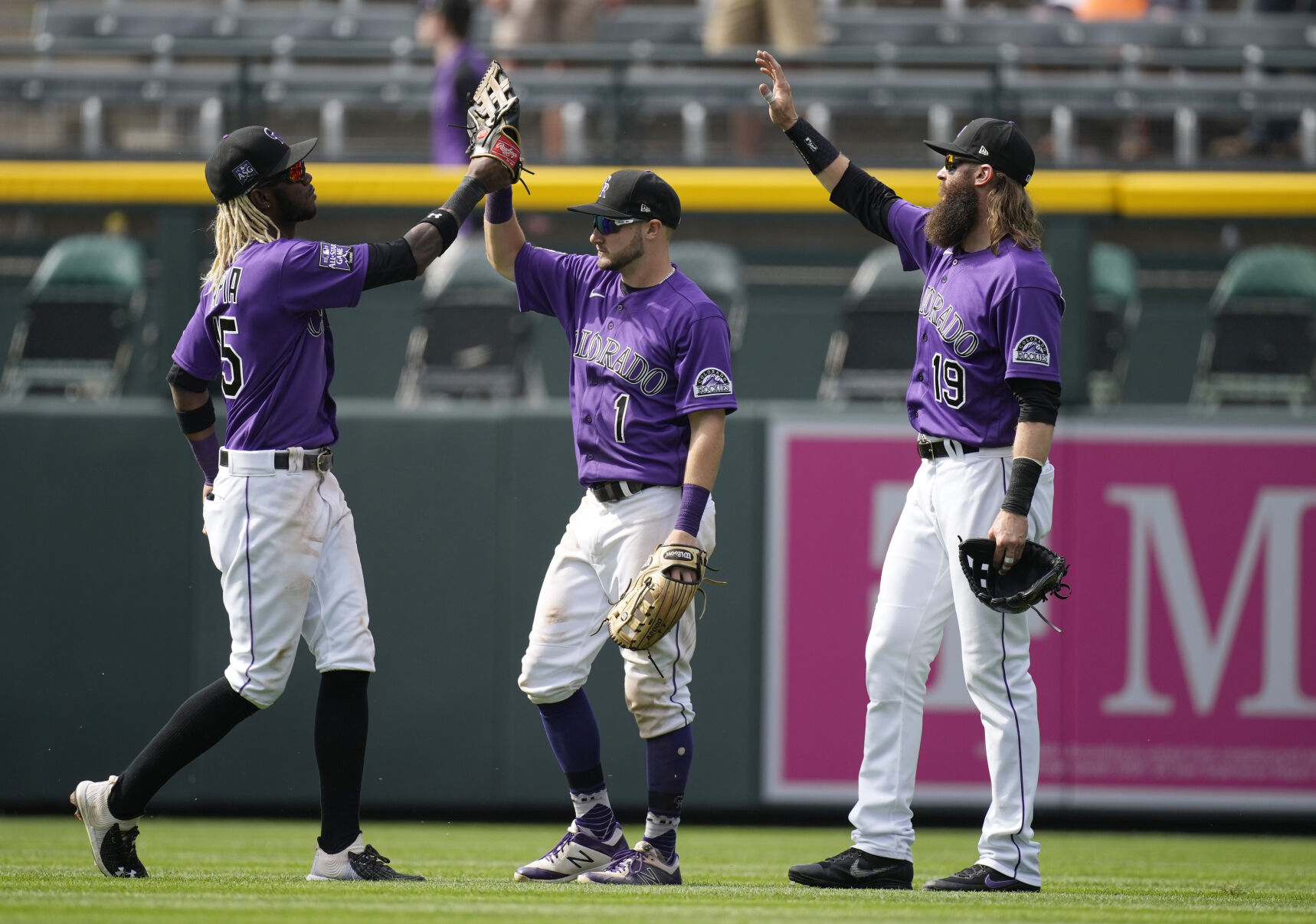 Colorado Rockies left fielder Raimel Tapia, center fielder Garrett Hampson and right fielder Charlie Blackmon, from left, celebrate after the team's baseball game against the Pittsburgh Pirates on Wednesday, June 30, 2021, in Denver. The Rockies won 6-2. (AP Photo/David Zalubowski) (David Zalubowski)