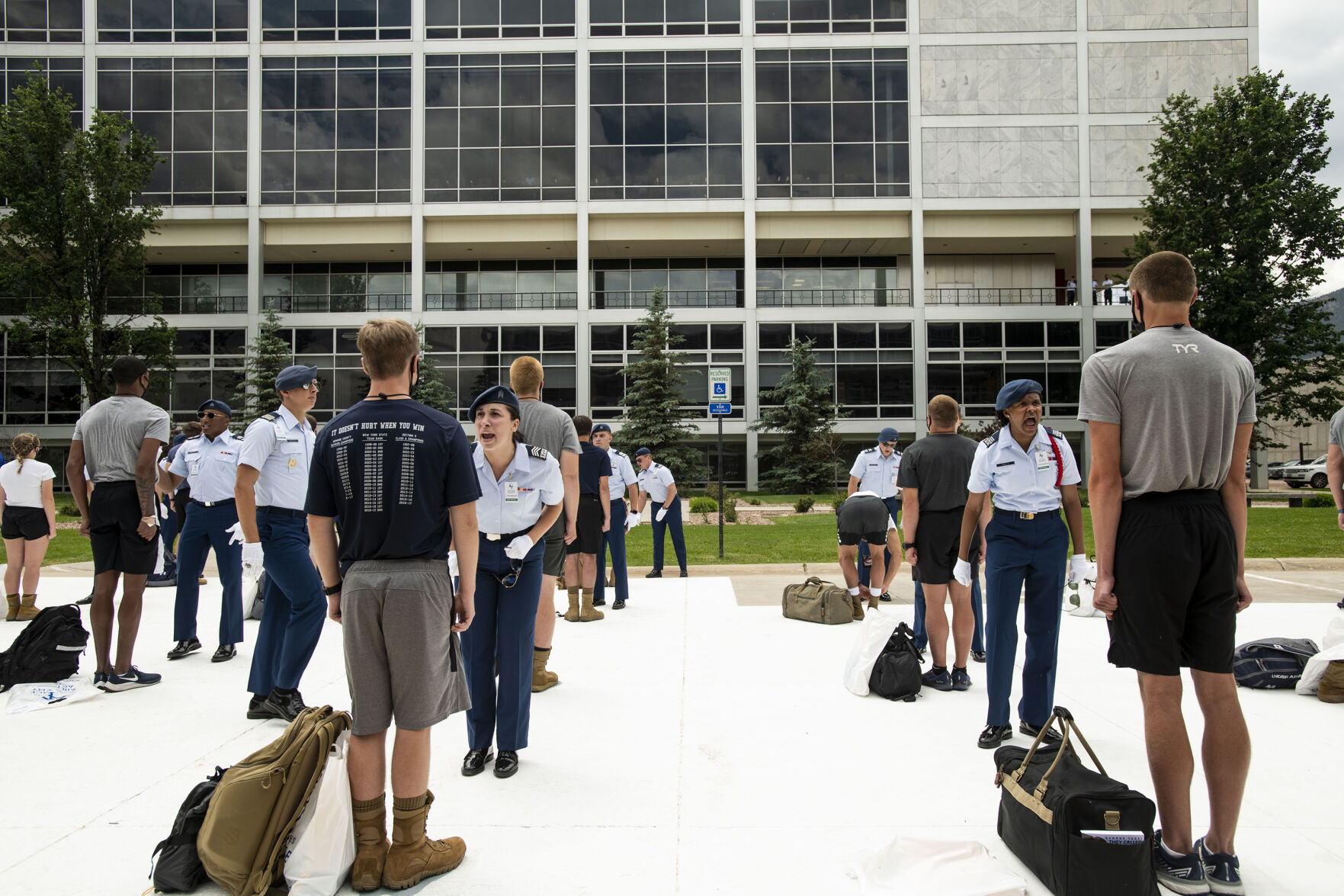 Cadre members yell at a basic cadets during In-Processing Day at the United States Air Force Academy in Colorado Springs, Colo., on Thursday, June 24, 2021. Over 1,100 incoming freshman will endure six weeks of basic training before officially becoming cadets.(Chancey Bush/ The Gazette) (Chancey Bush/ The Gazette)