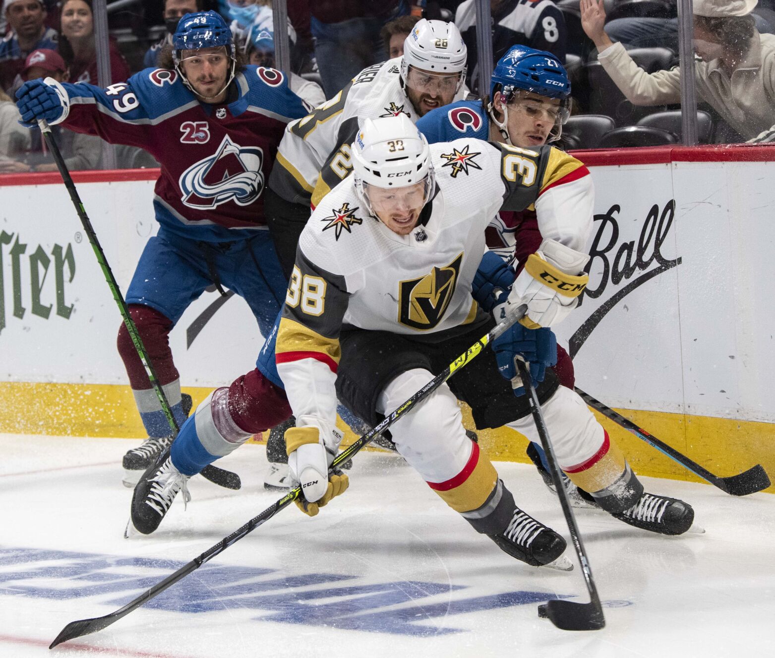 Vegas Golden Knights center Patrick Brown (38) and Colorado Avalanche defenseman Ryan Graves (27) battle for the puck during the first period of game two in the second round of the Stanley Cup Playoffs Wednesday, June 2, 2021, at Ball Arena in Denver. (The Gazette, Christian Murdock) (Christian Murdock/The Gazette)