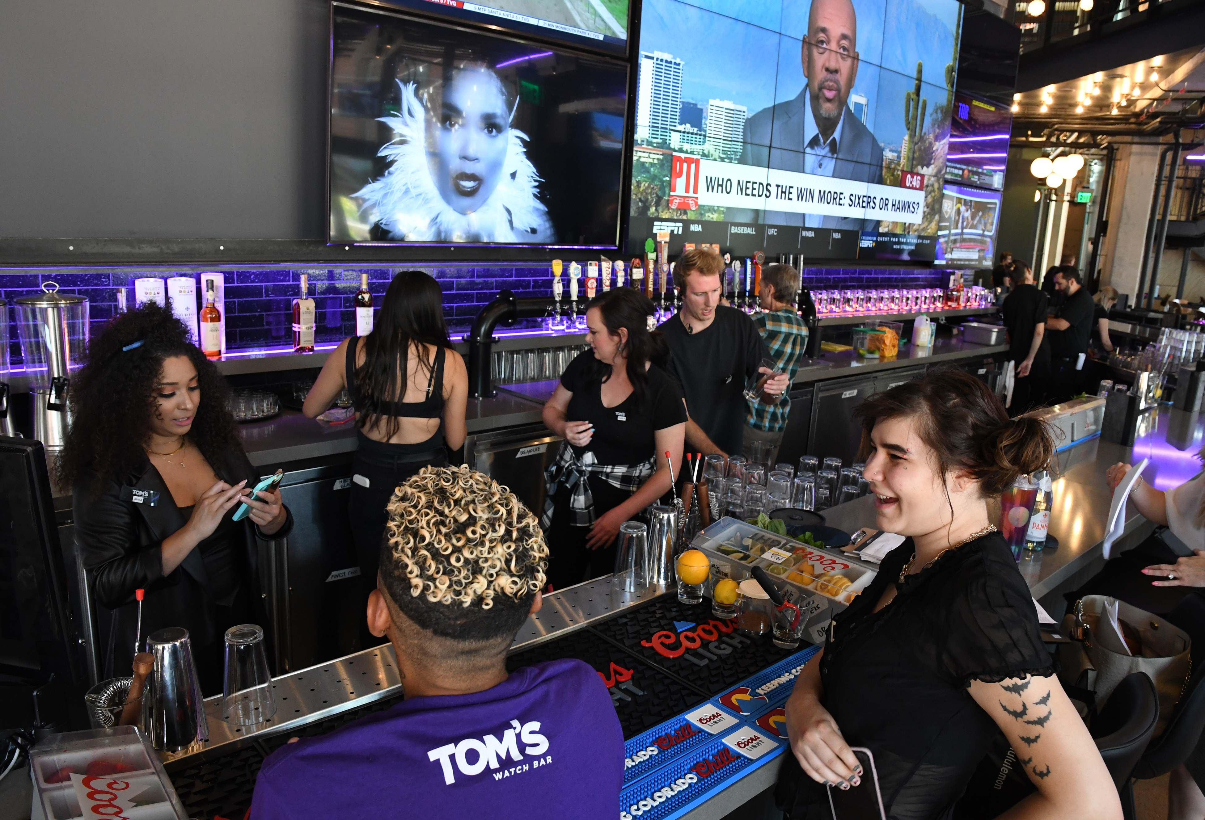 DENVER, CO - JUNE 11: The bartenders and wait staff at Tom’s Watch Bar prepare for a soft-opening of the restaurant in McGregor Square. McGregor Square hosts its grand opening celebration on June 11, 2021 in Denver, Colorado. The new complex, located across the street from Coors Field ballpark, includes a new hotel, luxury condos, office space, a Tattered Cover bookstore, and bars and restaurants. (Kathryn Scott, Denver Gazette)