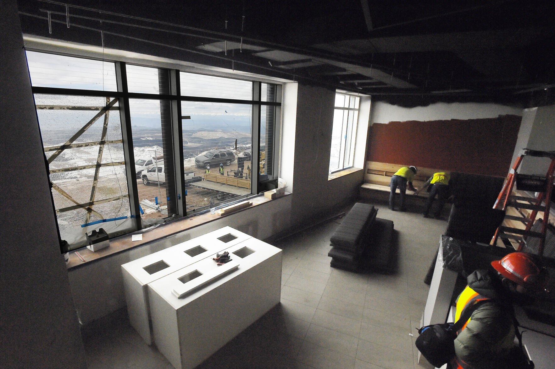Construction workers work on seating at the Summit House on top of Pikes Peak on Tuesday, April 27, 2021 (Photo by Jerilee Bennett, The Gazette) (JERILEE BENNETT)