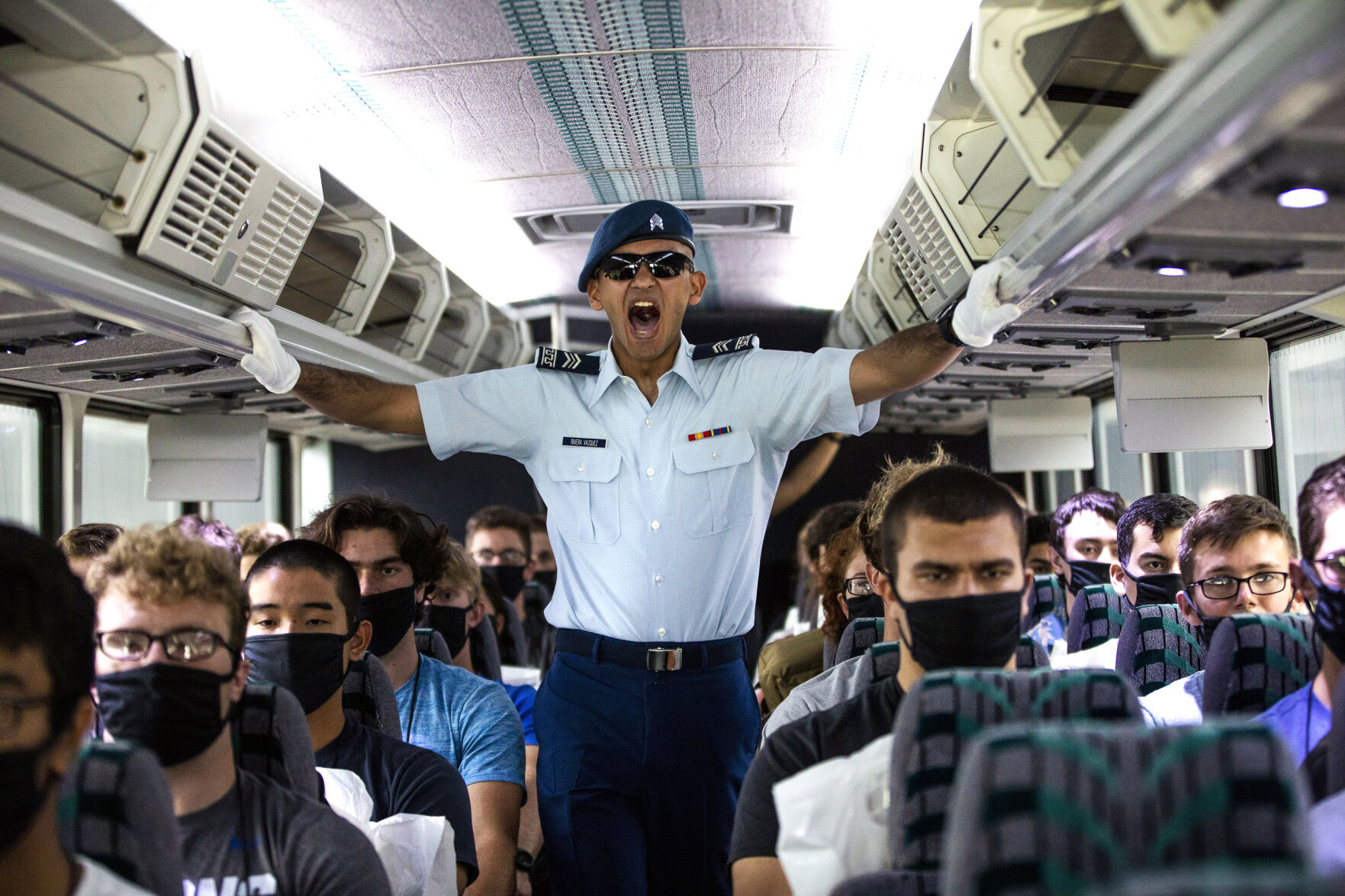 Cadre member Rivera Vazquez yells at a basic cadet on the bus to the footprints during In-Processing Day at the United States Air Force Academy in Colorado Springs, Colo., on Thursday, June 24, 2021. Over 1,100 incoming freshman will undergo six weeks of basic training before officially becoming cadets.(Chancey Bush/ The Gazette) (Chancey Bush/ The Gazette)