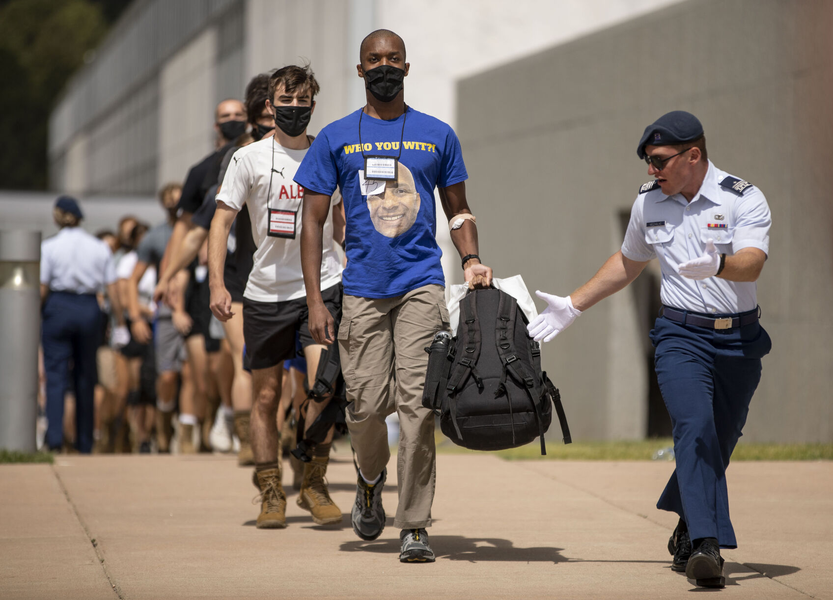 Basic cadets make their way to the bus during In-Processing Day at the United States Air Force Academy in Colorado Springs, Colo., on Thursday, June 24, 2021. Over 1,100 incoming freshman will undergo six weeks of basic training before officially becoming cadets.(Chancey Bush/ The Gazette) (Chancey Bush/ The Gazette)