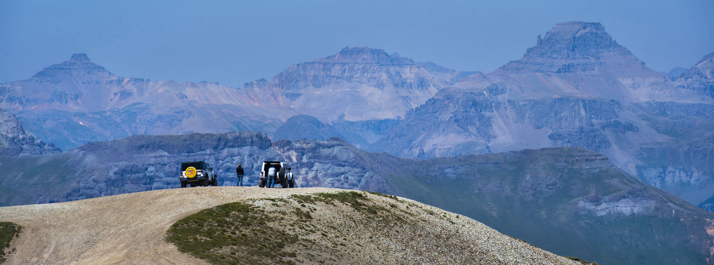 Four wheelers take in the views of the San Juan Mountains from the Oh! Point lookout near the summit of 12,800-foot Engineer Pass while exploring the historic Alpine Loop Monday, July 30,2018. Engineer Pass begins outside Ouray, Colo. and runs east 30.9 miles, 27.2 miles unpaved, to Lake City. (CHRISTIAN MURDOCK)