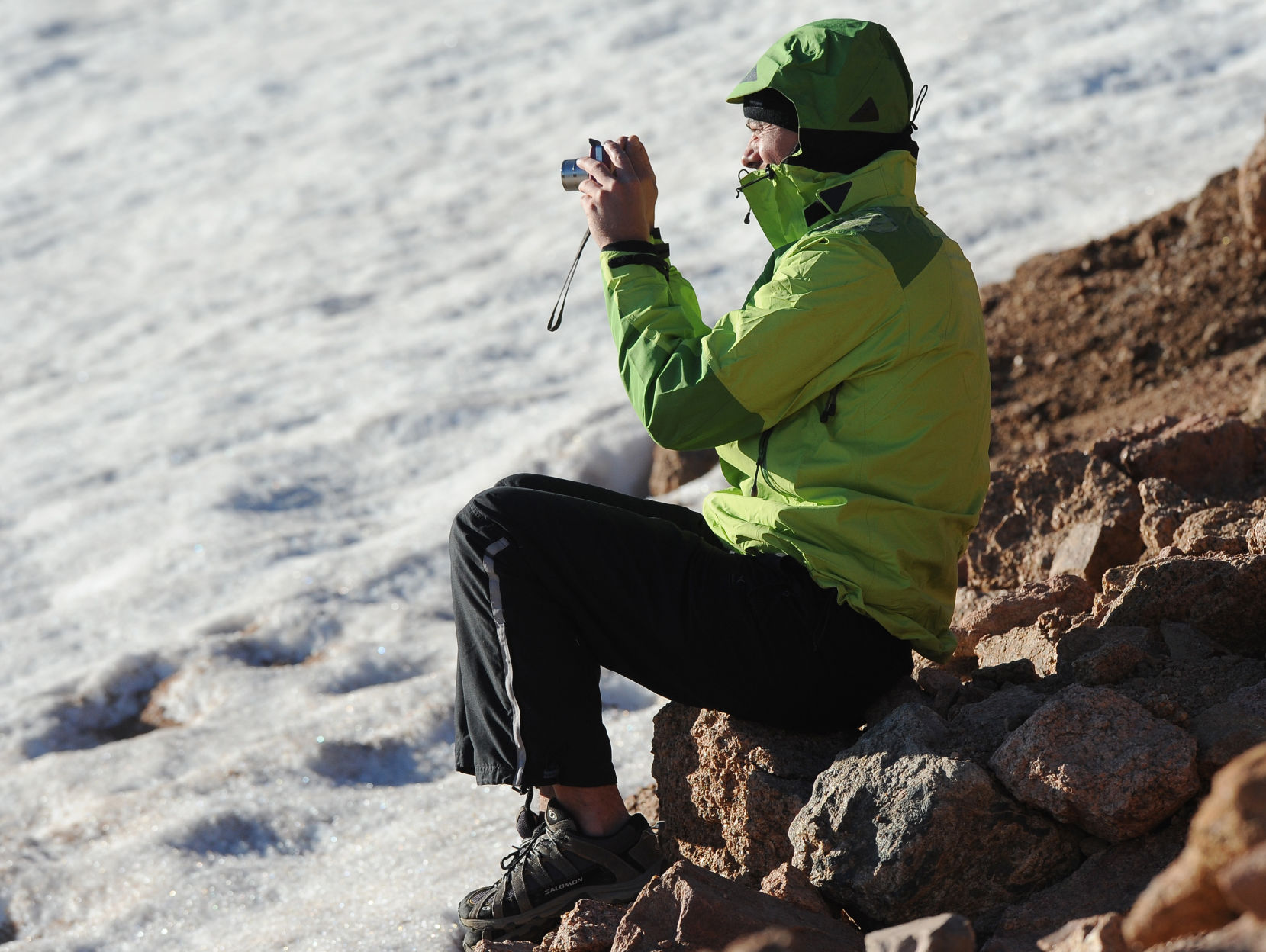 Matthu Huey came from Paris, France to watch the Pikes Peak International Hill Climb on Wednesday, June 23, 2010. He was taking photos from next a snow field near mile marker 16. (The Gazette/Jerilee Bennett) (Jerilee Bennett)