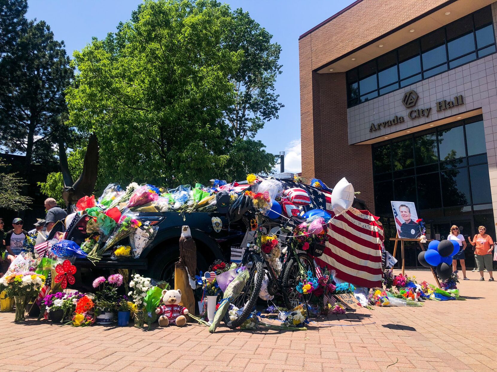 Scenes from outside the Arvada Police Department a day after a shooting left three people dead, including a police officer. (Katie Klann)