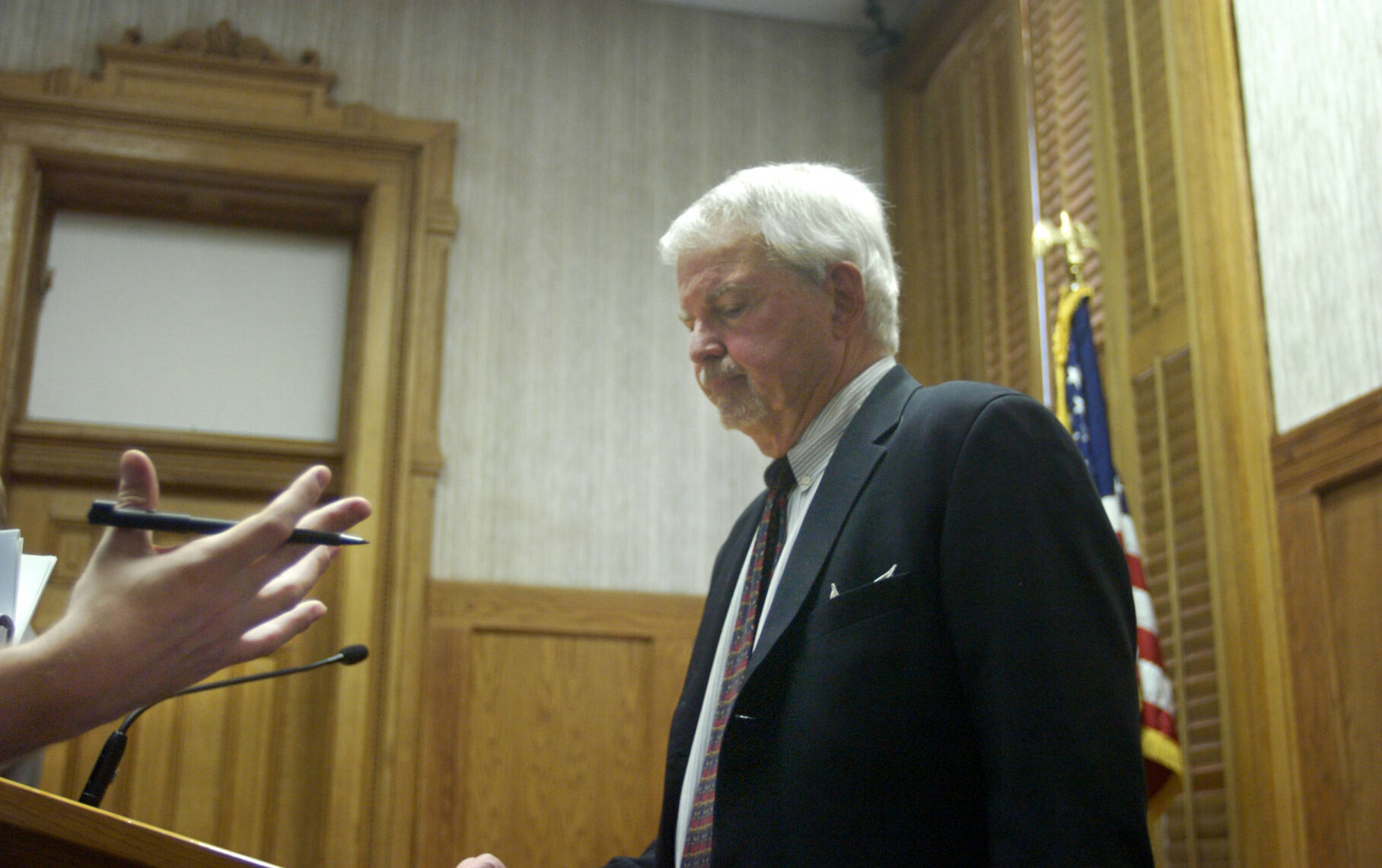 Former governor Richard Lamm takes comments from a member of the media following the Defend Colorado Now press conference at the capitol on Jan 4, 2006. Defend Colorado Now announced a ballot initiative that would prevent illegal immigrants from getting non-emergency public services. (Donated to the Denver Public Library by the Rocky Mountain News / David M. Barreda)