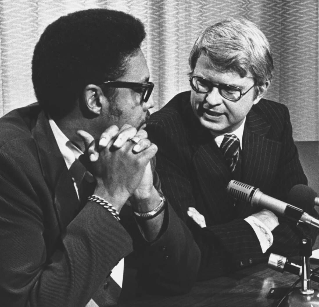 Lt. Gov.-elect George Brown, left, was squarely in the middle Friday as Gov.-elect Richard D. Lamm, right, announced a list of state appointments which didn't include a Black person. Brown stood by Lamm despite heavy criticism from other Black officials. (Donated to the Denver Public Library by the Rocky Mountain News / Joe Gordon)