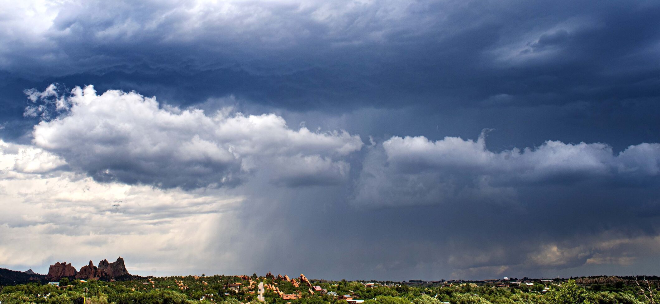 A summer thunderstorm rains on northern Colorado Springs with Garden of the Gods in the foreground Sunday, July 12, 2020. (The Gazette, Christian Murdock) (CHRISTIAN MURDOCK/THE GAZETTE)