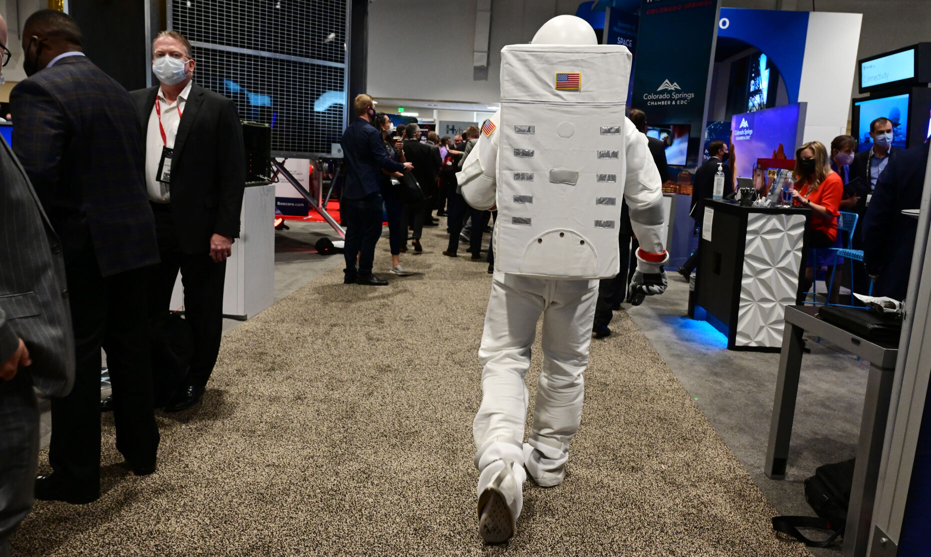 Even an astronaut likes to check out the swag at the other exhibits at the Space Symposium at the Broadmoor Hotel. Michael Ballantyne from the Global Space Exchange exhibit was checking out the other exhibits on Tuesday, Aug. 24, 2021. (Photo by Jerilee Bennett, The Gazette) (JERILEE BENNETT THE GAZETTE)